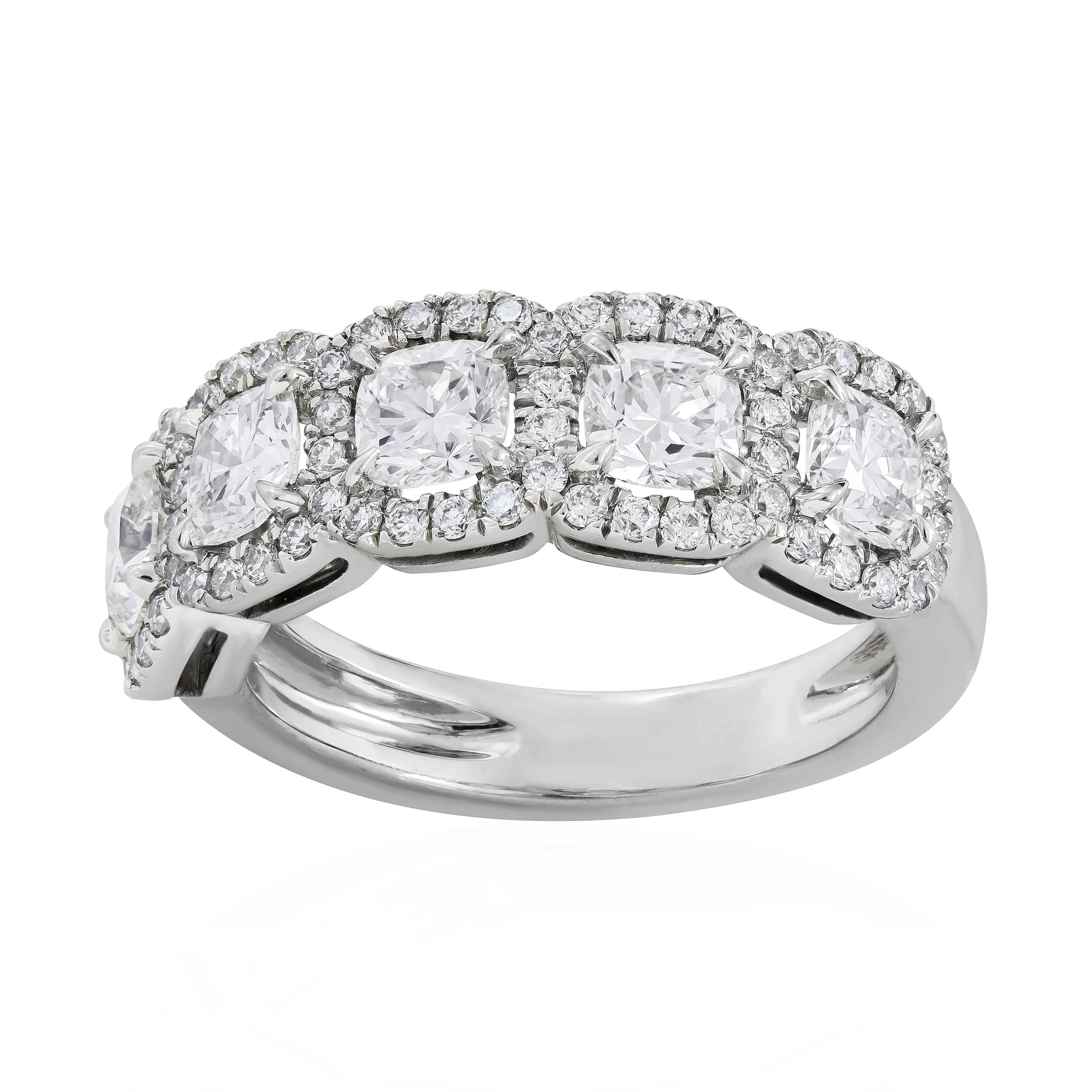 This an incredibly unique yet beautiful wedding band featuring 5 perfectly matched cushion cut diamonds weigh 1.54 carats total. The diamonds are approximately G color, VS clarity. Each cushion diamond is elegantly set in a sparkling diamond