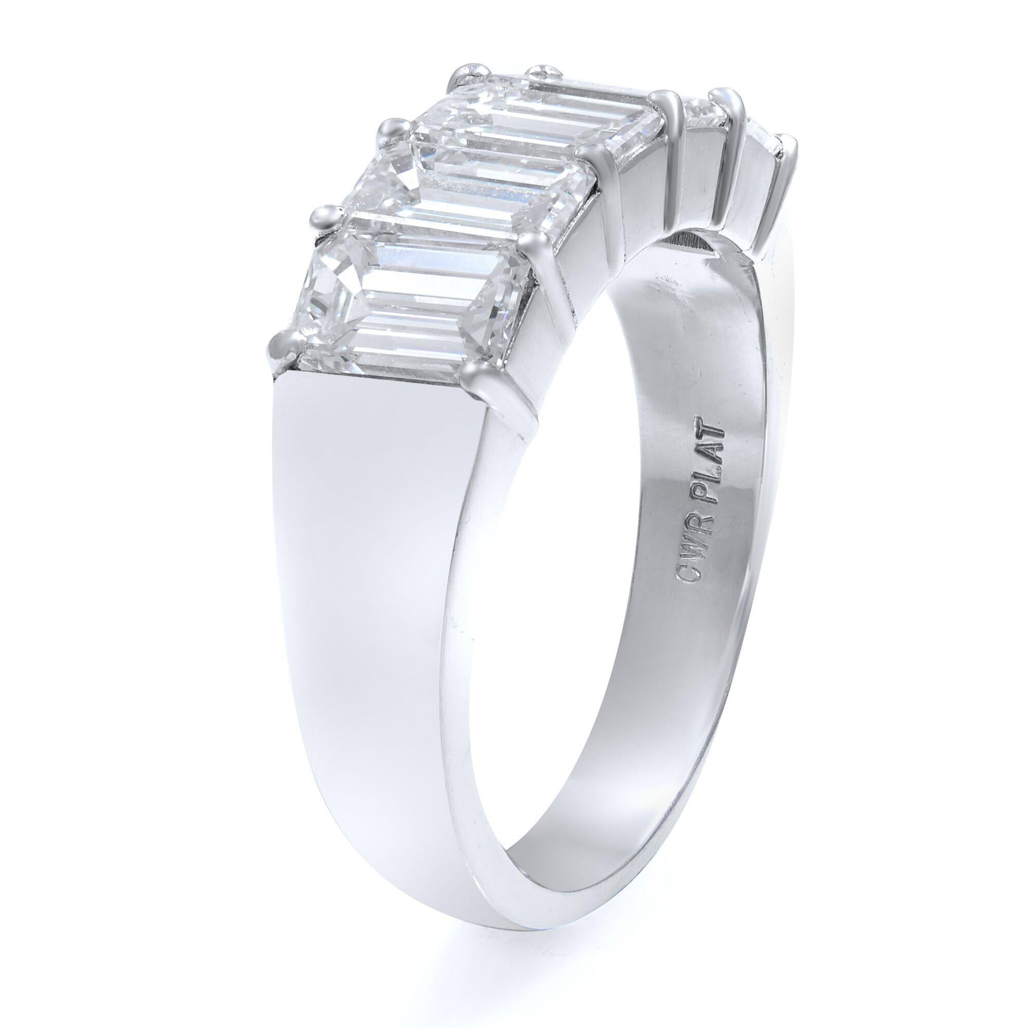 This classic ring features five beautifully matched emerald cut diamonds set in enduring platinum. Glistening with 2.57 carats of diamonds. Stone measurements are 6x8mm and weight of the whole piece is 5 grams. The clarity and color of the stones
