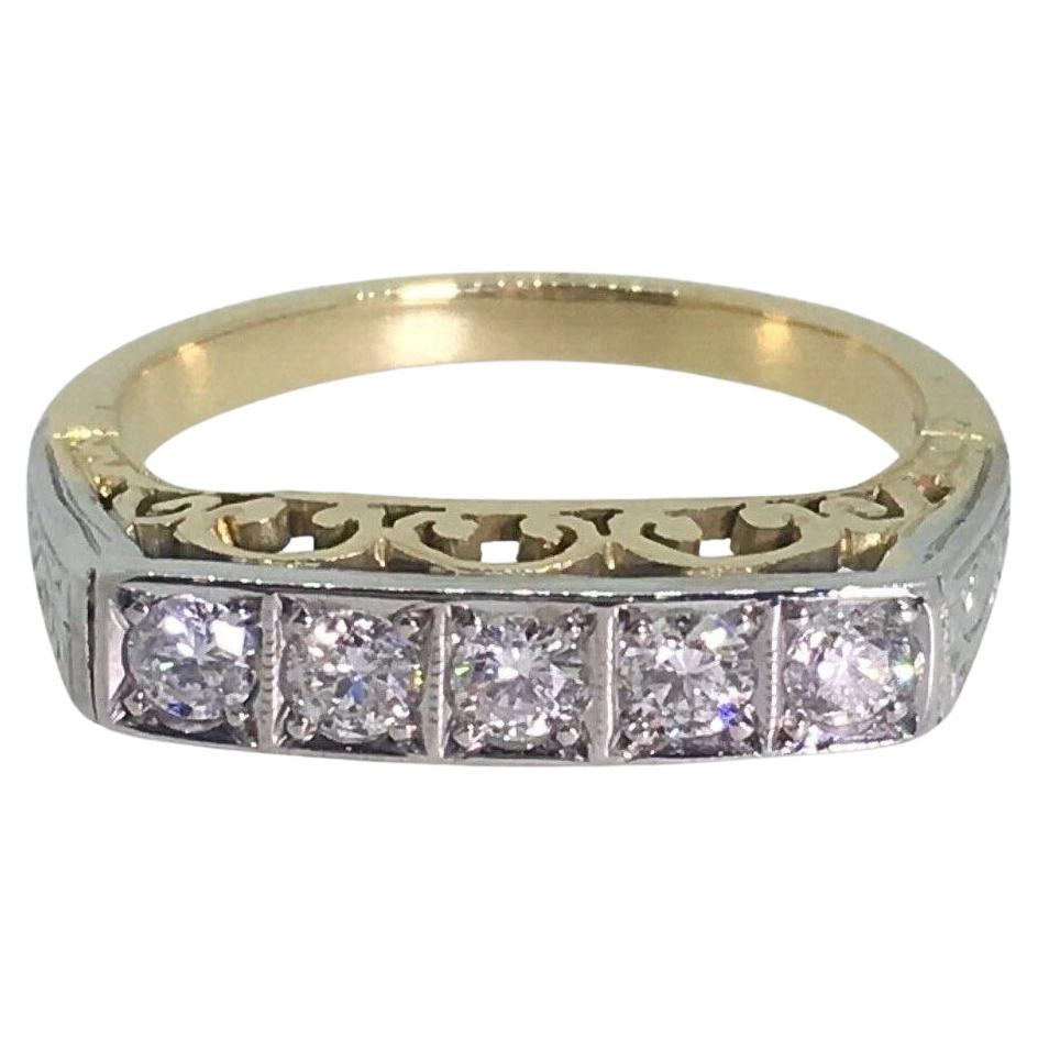 Medio aro/anillo con cinco diamantes en platino y oro amarillo de 18 ct