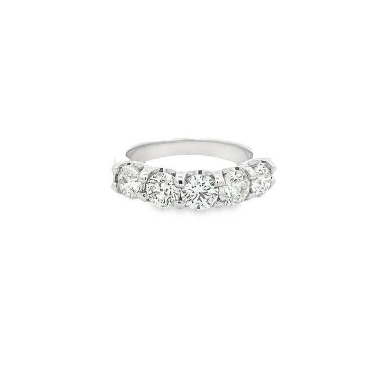 Experience the epitome of elegance and sophistication on your wedding day with our breathtaking five-stone wedding band. This extraordinary design is an exquisite statement piece featuring five round diamonds, weighing a total of 2.05 carats,