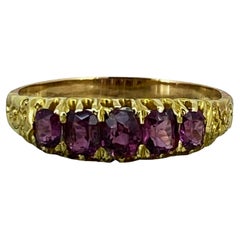 Five-Stone Half Hoop 0.75ct Oval Ceylon Ruby Retro Ring in 18K Yellow Gold.