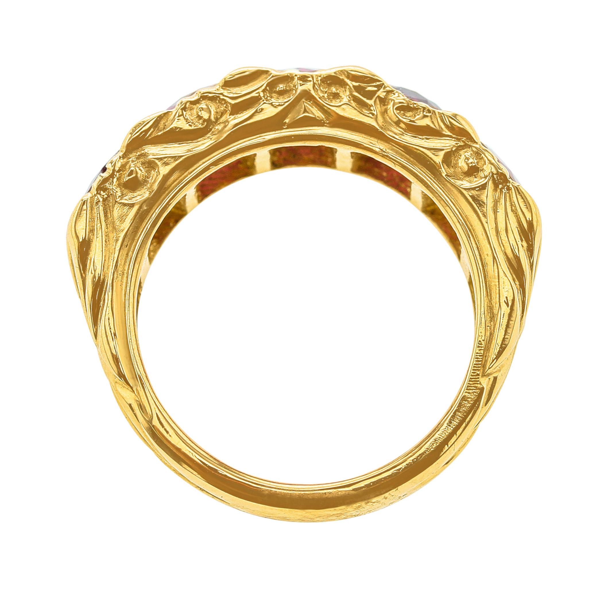 A Horizontal Five Stone Ruby Band in 18K Yellow Gold with a decorative antique-style mounting. Each ruby is appx. 0.58 carats. Ring Size US 6.25. 