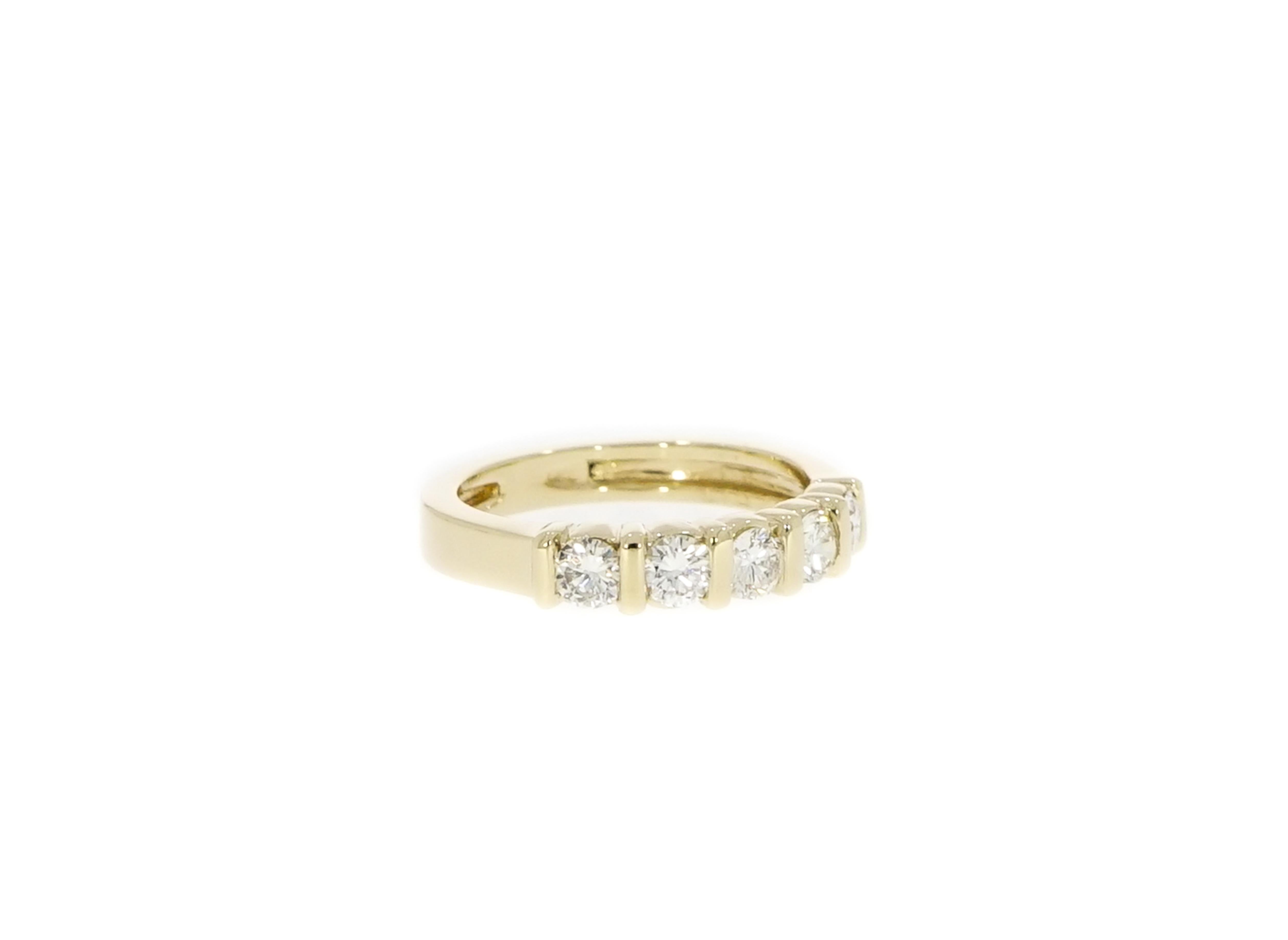 This classic and elegant design, is obtained by harmoniously setting the diamonds between gold bars creating an innovative band to celebrate your 5 year anniversary or just to wear with your existing rings.
Handcrafted in 14k yellow gold with 5
