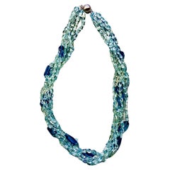Perles ovales facettées aigue-marine à cinq brins et topaze bleue