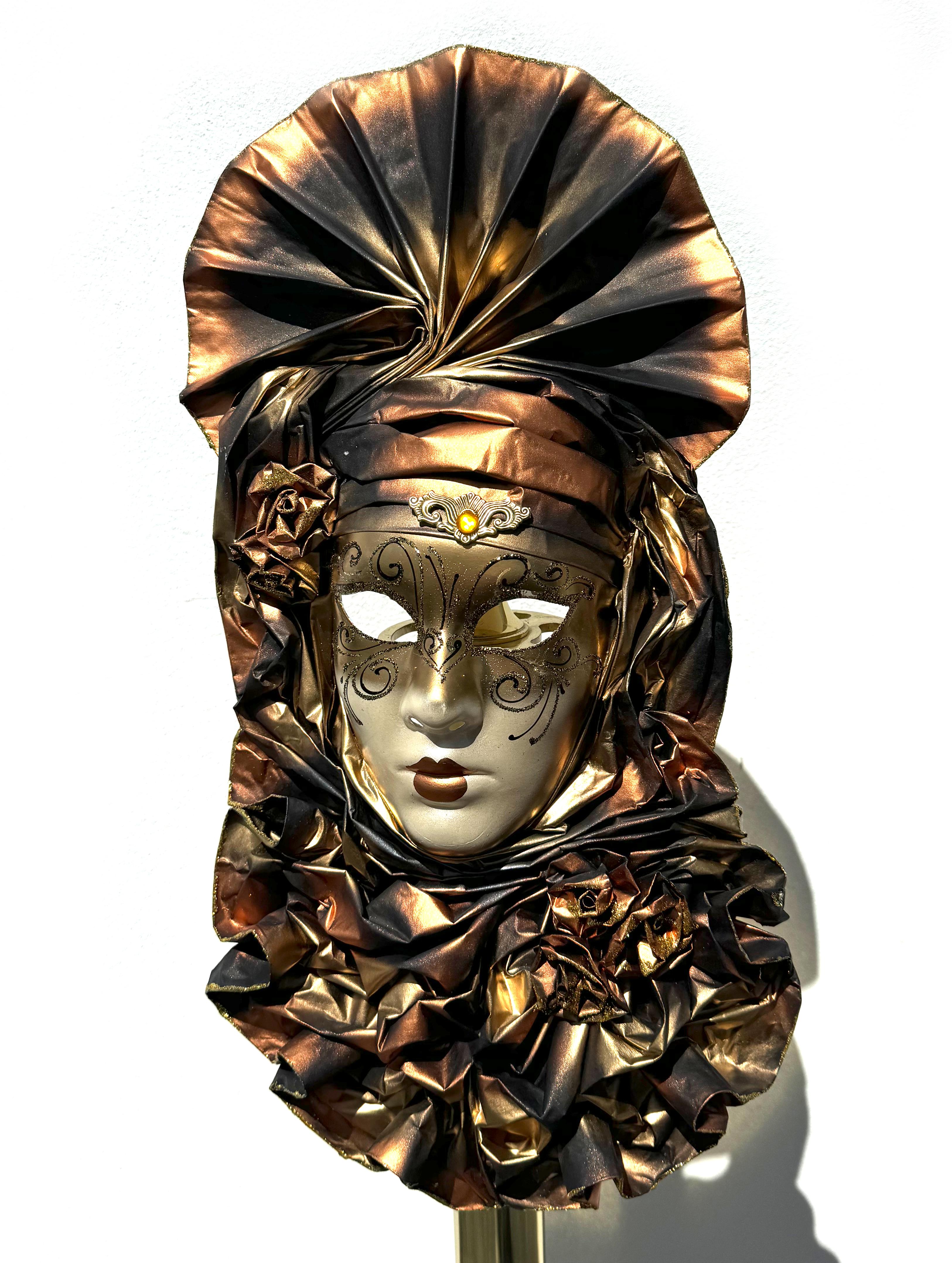 
Five Venetian Carnival Masks
Containing painted and paper-mounted examples and two large painted composition masks, one painted in lavender and gold, the other red and silver with examples. Height of two large masks 23 in., 34 in.,