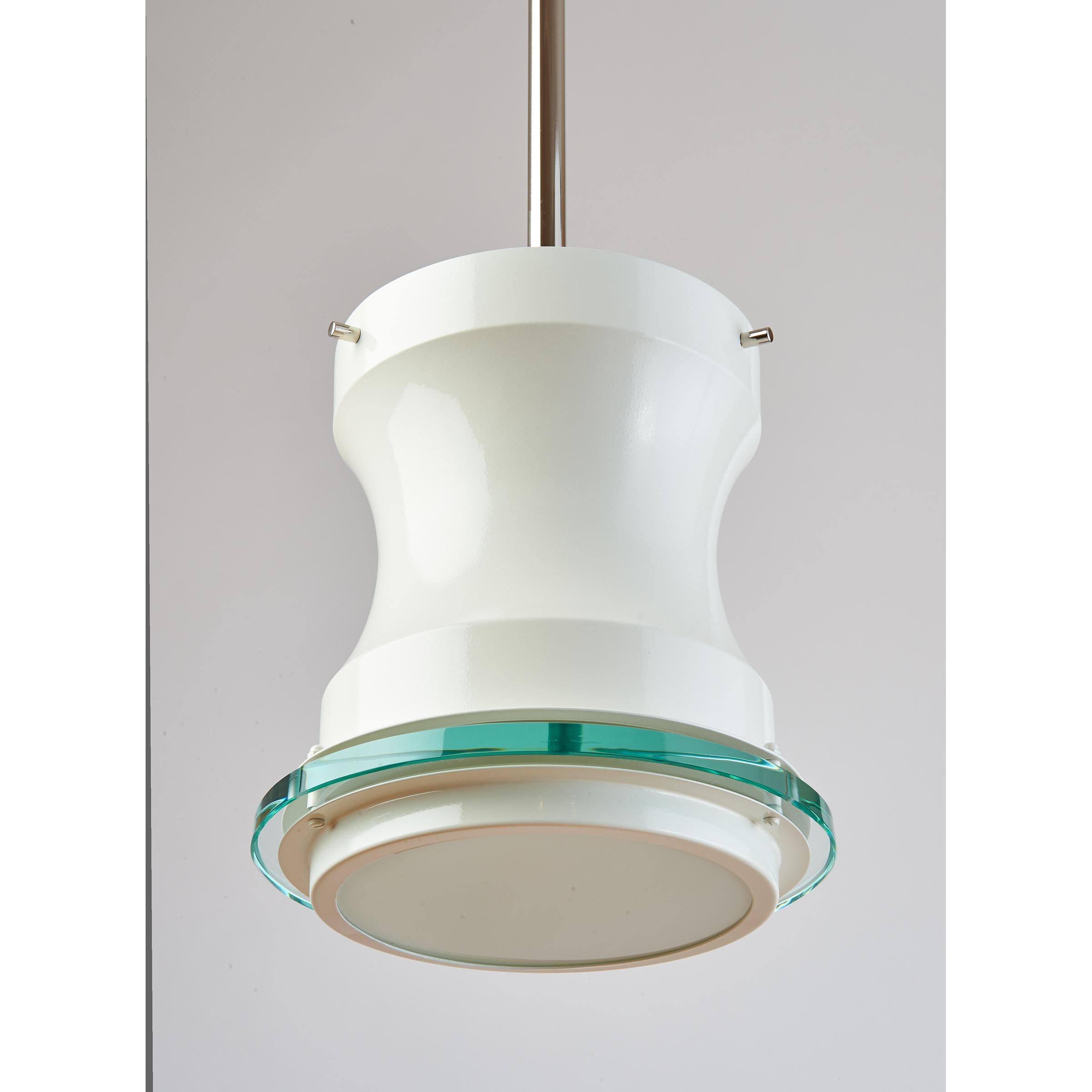STILNOVO, 1960s
Two white enameled lanterns with clear and opaline glass diffusers, nickeled mounts. Could be mounted as ceiling lights.
Rewired for the U.S. with one standard base bulb, up to 100 W
Italy, 1960s
Measures: 8 Diameter x 40 H