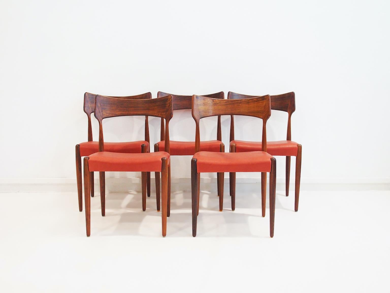 Bernhard Petersen & Son chairs, produced by Christian Linneberg's furniture factory in Denmark. There are five available, price per chair. Seats upholstered in aniline leather in dark red with orange hues (looking a bit more orange on photos and