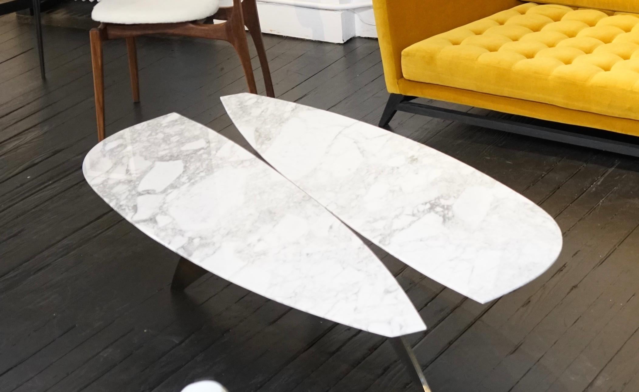 The Fjaril coffee table in marble and steel by Alexander Diaz Andersson has a steel base and a marble top available in white / black or custom marble.

The Fjail is named after the Swedish butterfly and takes its shape.

The aesthetic of this