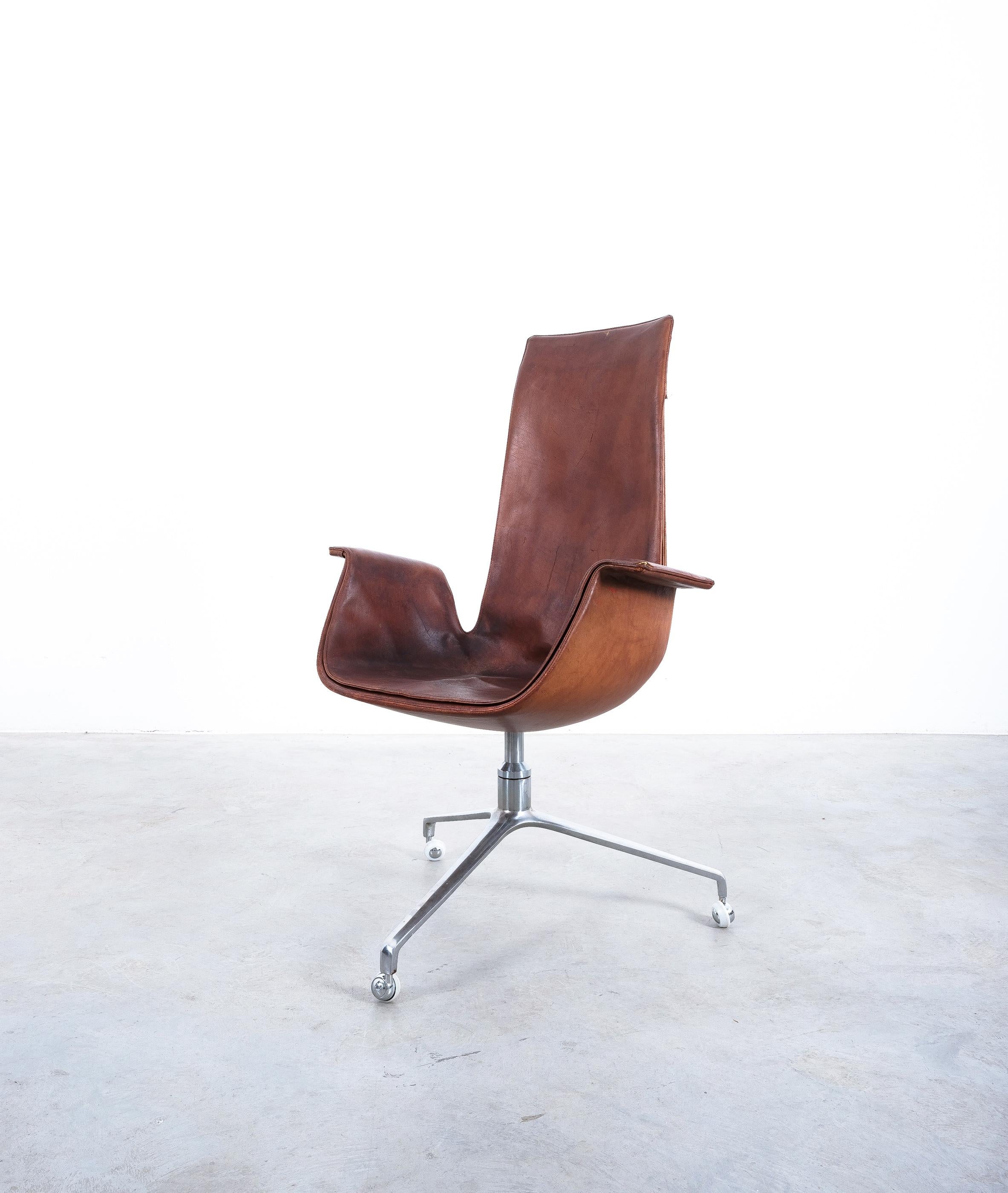 Original mid century brown leather desk chair on a swivel base (seat height 18.8