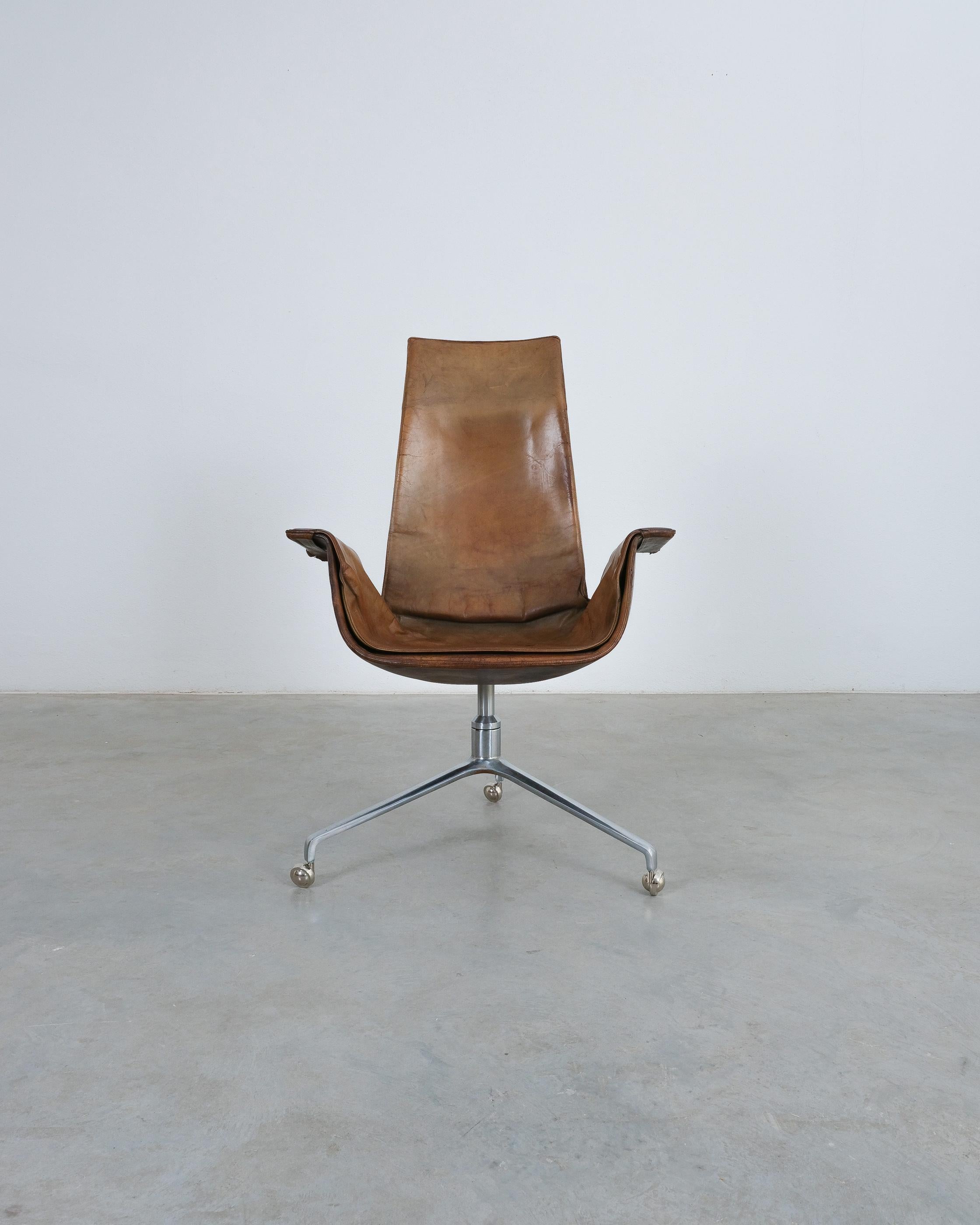 Original mid century brown leather desk chair on a swivel base (seat height 18.8