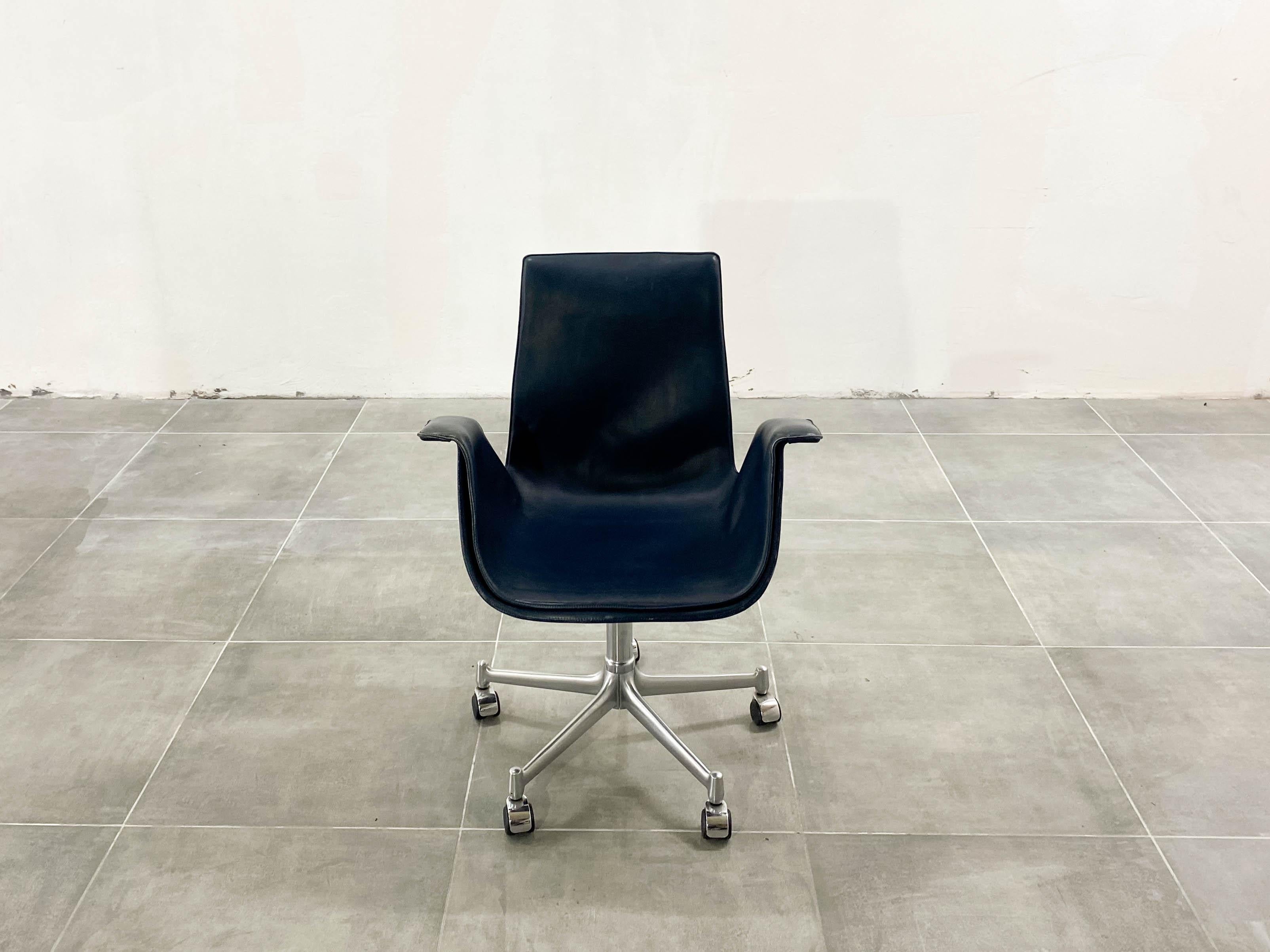 Comfortable office chair. No height adjustment. Navy blue leather. 