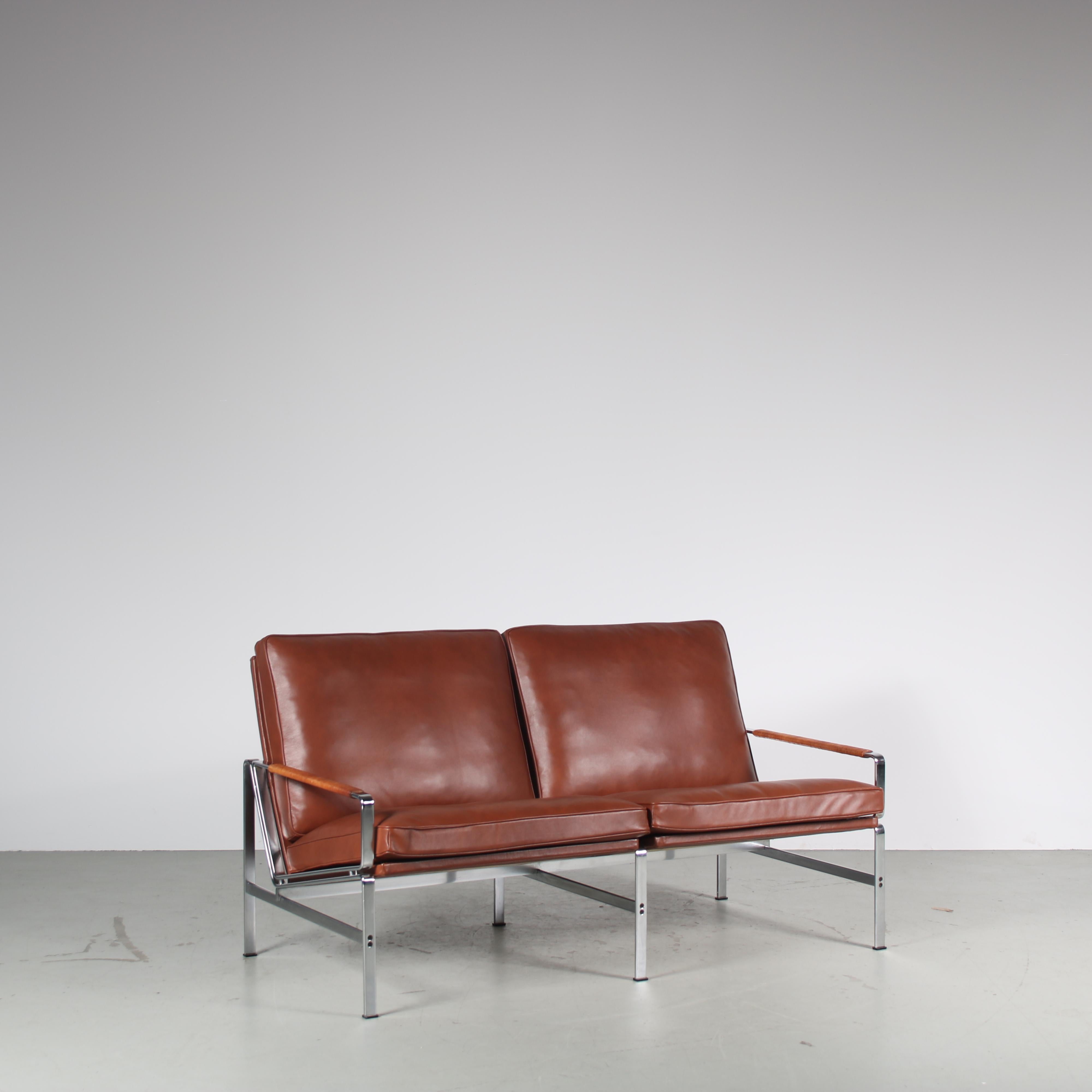 A fantastic 2-seater sofa, model “FK6720”, designed by Preben Fabricius and Jørgen Kastholm, manufactured by Kill International in Germany around 1960.

Thhis stunning piece is newly upholstered in the best quality brown leather with a wrapped