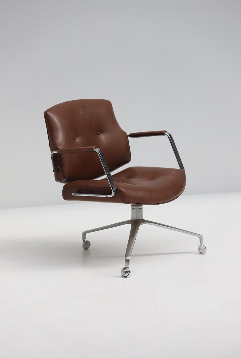 Rare conference or office FK-84 armchair designed by Preben Fabricius and Jorgen Kastholm. Manufactured by Kill International, Denmark 1970s. This chair stands in a well preserved condition and is upholstered with a chocolate brown leather. The