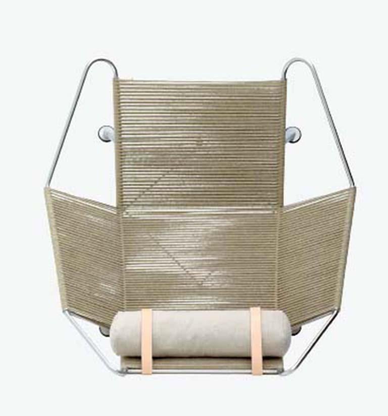With a frame made of solid stainless steel, 240 metres specially developed flag line forming the seat and back, and a longhaired sheepskin softening the Industrial sharpness of the steel, this chair constitutes ultimate and luxurious relaxation.