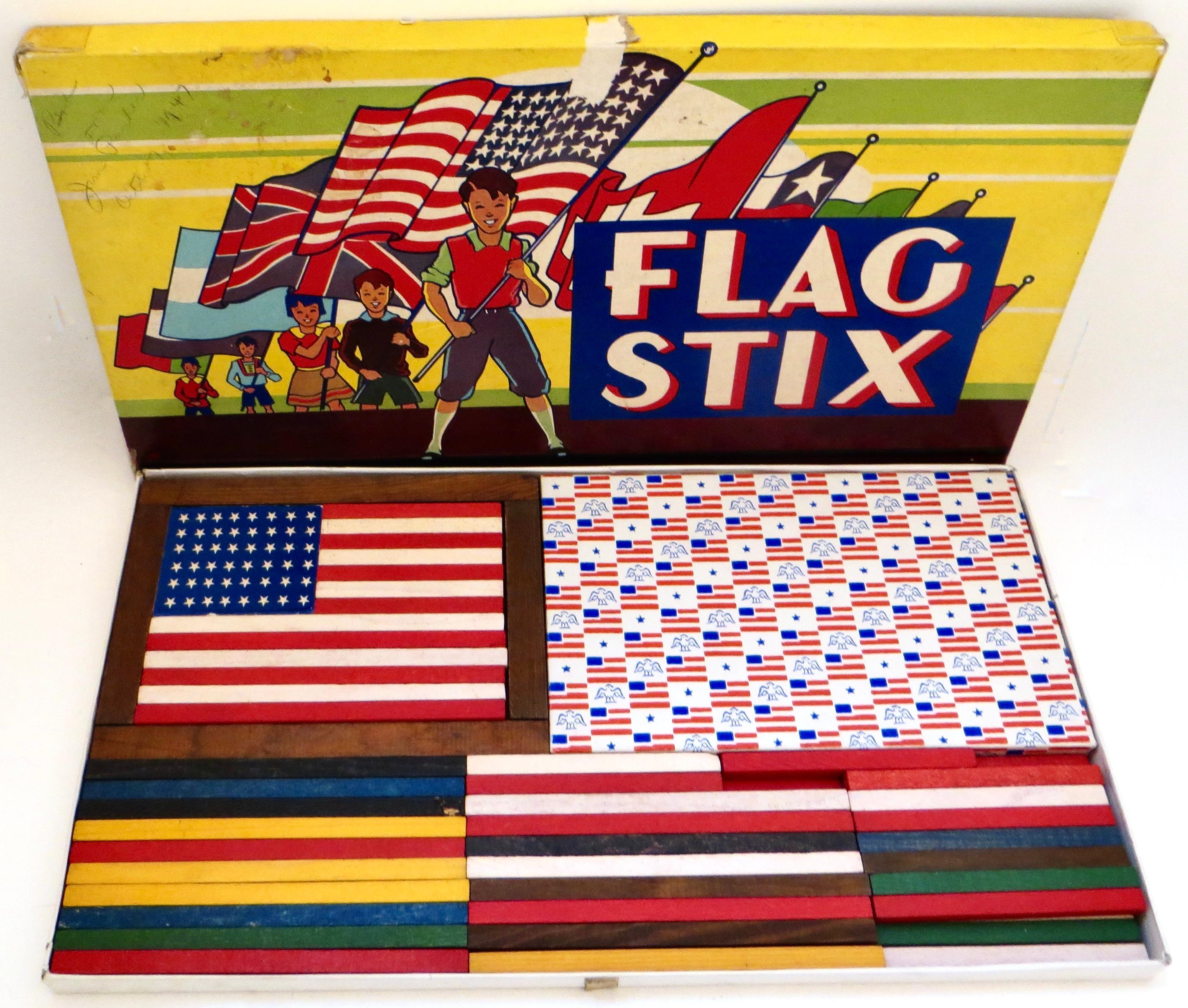 Fabulous all original condition to this vintage boxed colorful children's play set that provides the ability to create different international flags using the wooden sticks provided; including a great rendition of our own American flag (see images).