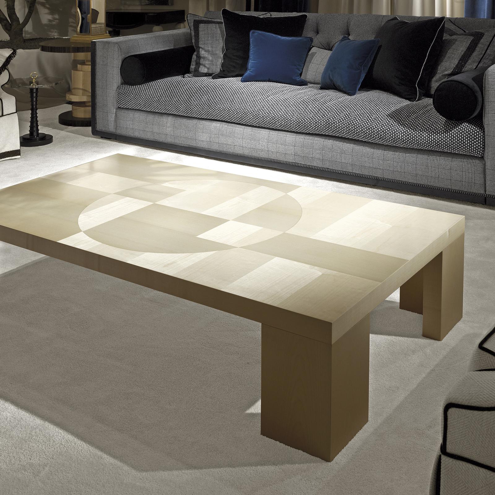 A celebration of pure geometry and sophisticated design, this coffee table is an elegant and timeless addition to any living room. Its simple, low profile is crafted entirely by hand of maple. The delicate honey hues of the wood are charming and add