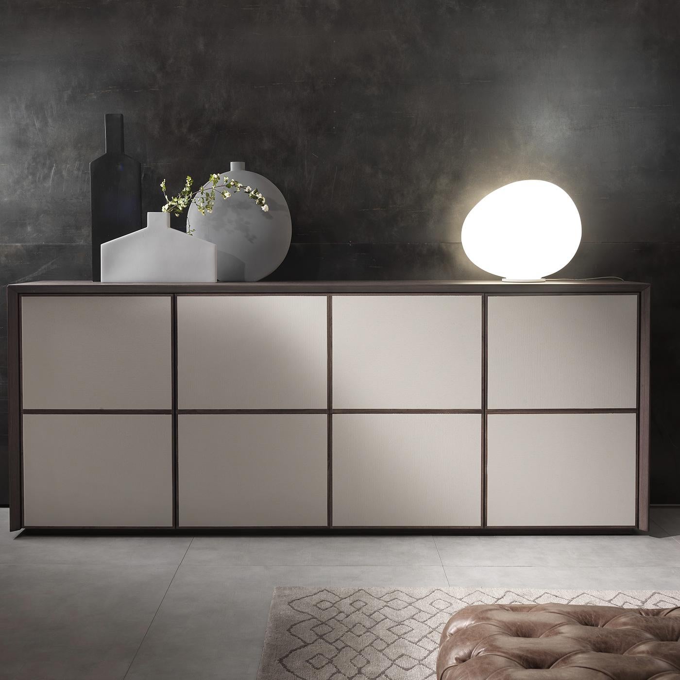 Designed by Giuliano Cappelletti, this cupboard is a bold combination of traditional and new materials in a minimalist silhouette that plays with pure geometric elements. It is crafted of wood with an ash veneer and profiles in solid wood. Its