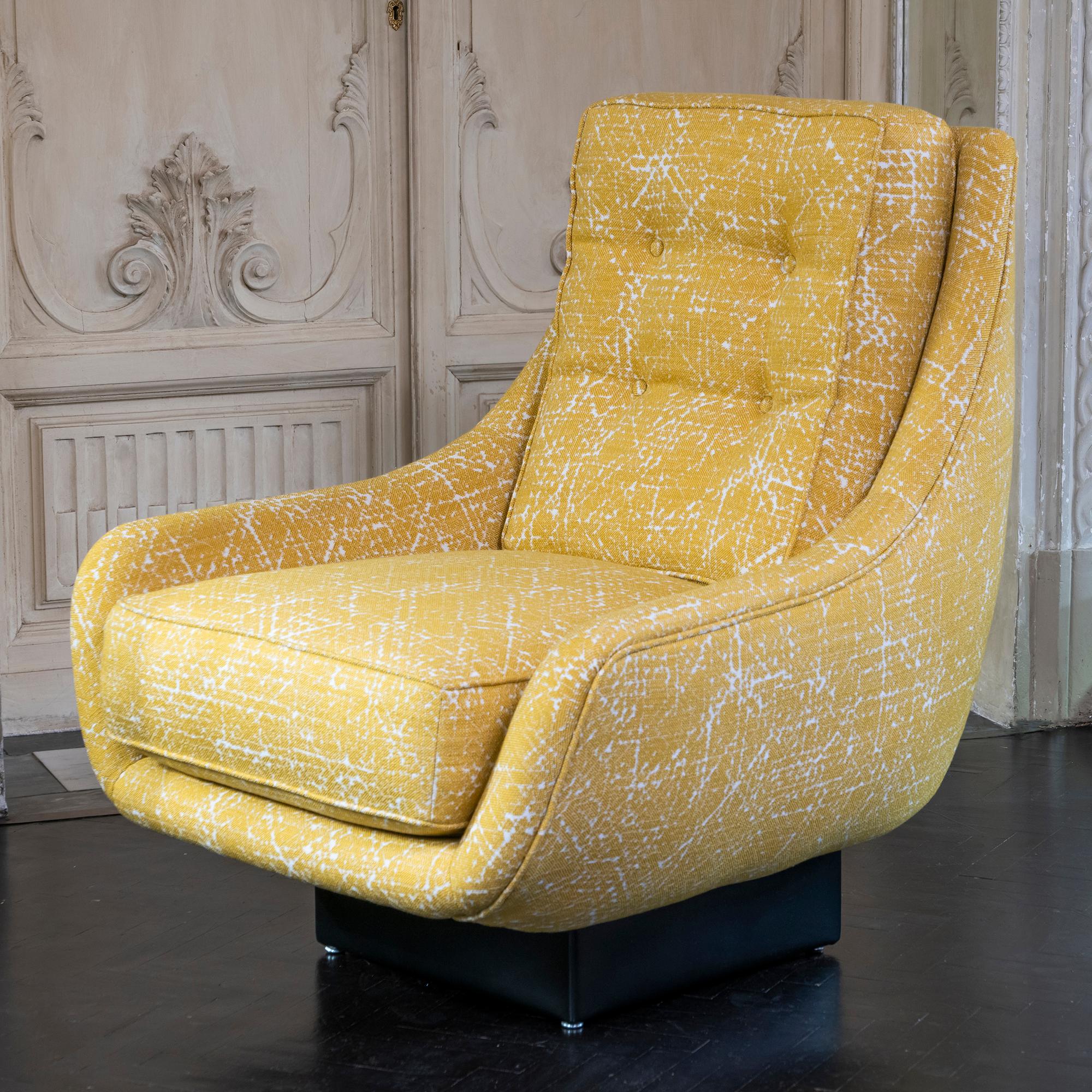 Contemporary armchairs part of the flair edition collection, upholstered in yellow and white jacquard fabric, black leather base, sold as a pair, Italy, 2020.