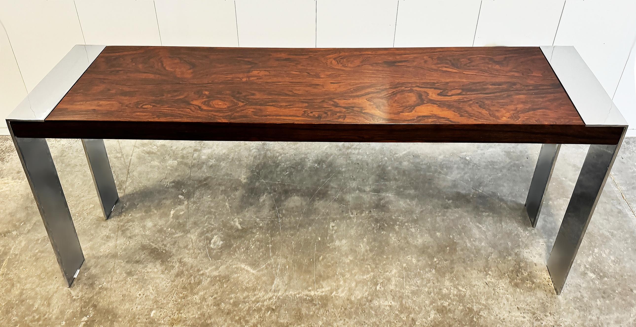 Flair Rosewood, Chrome Midcentury Console Table, Baughman Attributed

Offered for sale is a console table manufactured by Flair that is attributed to the designer Milo Baughman.  The console features a rich rosewood surface with sleek, flat chrome