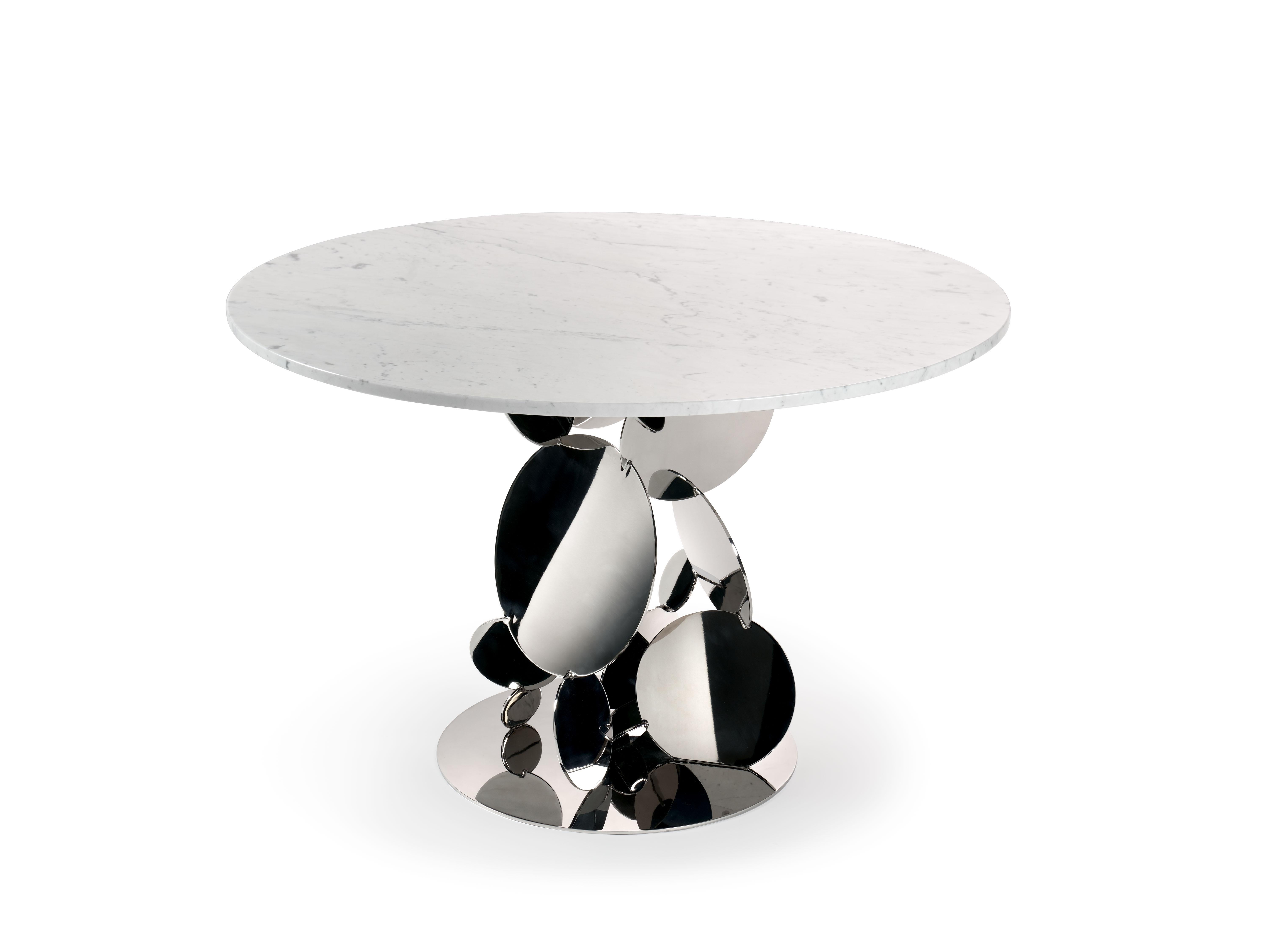 Flake Round Center Table by Barberini & Gunnell
Limited Edition of 45
Dimensions: D 112 x H 74 cm.
Materials: Carrara marble, mirror polished stainless steel.

Vibrant flakes of dancing lights in my eyes and blue in the background. This is just a
