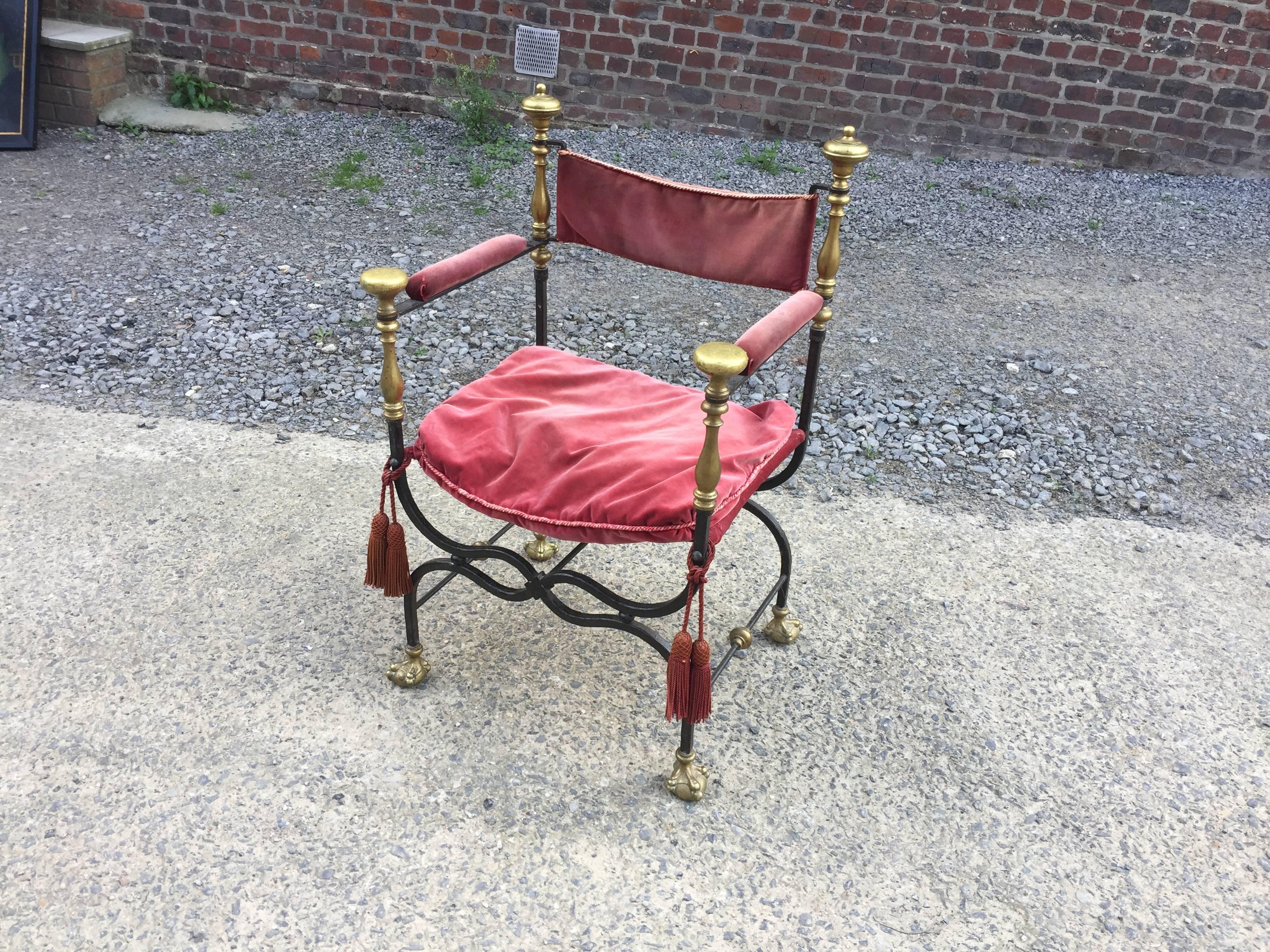 Flamand style curule armchair in wrought iron, brass and velvet, circa 1900.