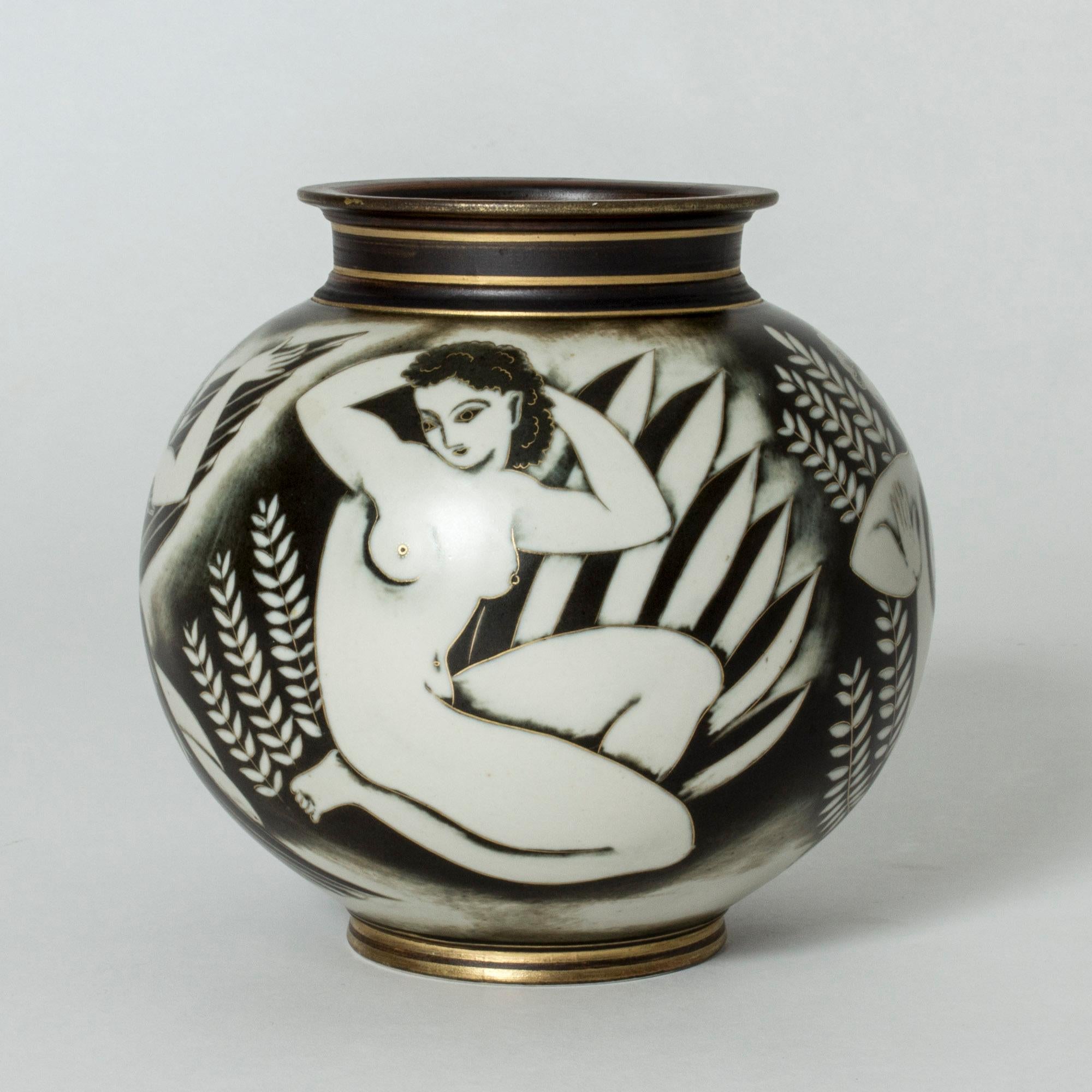 Amazing stoneware vase by Gunnar Nylund, from the “Flambé” series. Beautiful decor of four women among leaves, one of them with a black swan contrasting against her white form. Gold decor accentuates the women’s features as well as the top and base