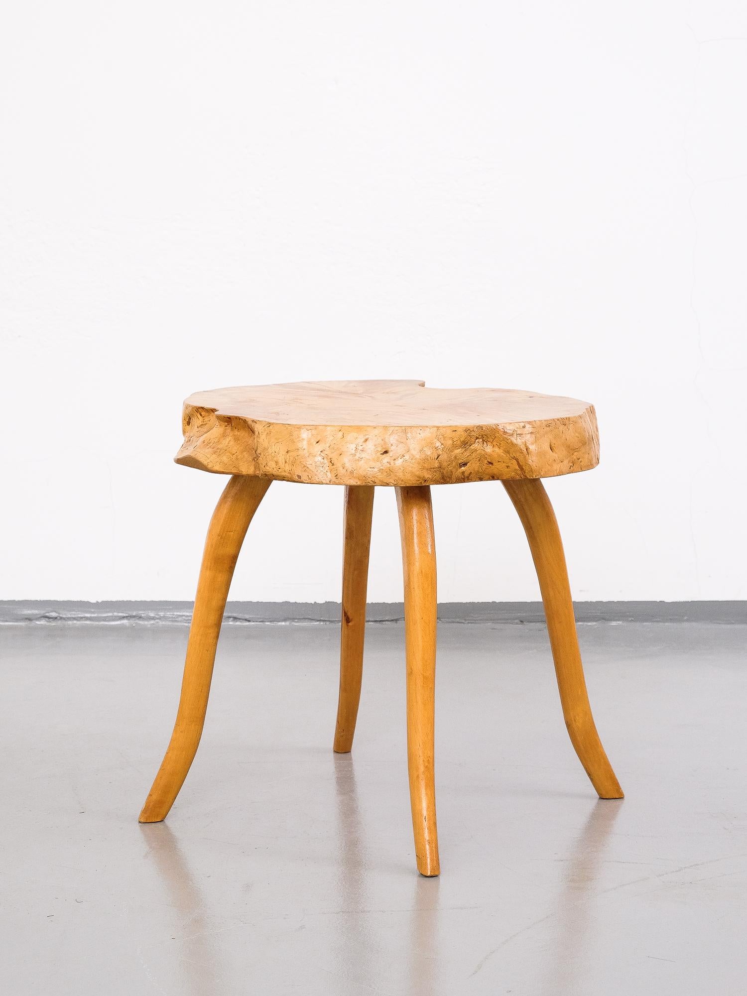 Beautiful flame birch coffee table from Finland by unknown maker, 1950s. Made from a flame birch slab with interesting wood grain. Elegant, sculpted legs that pick up the organic design of the tabletop.