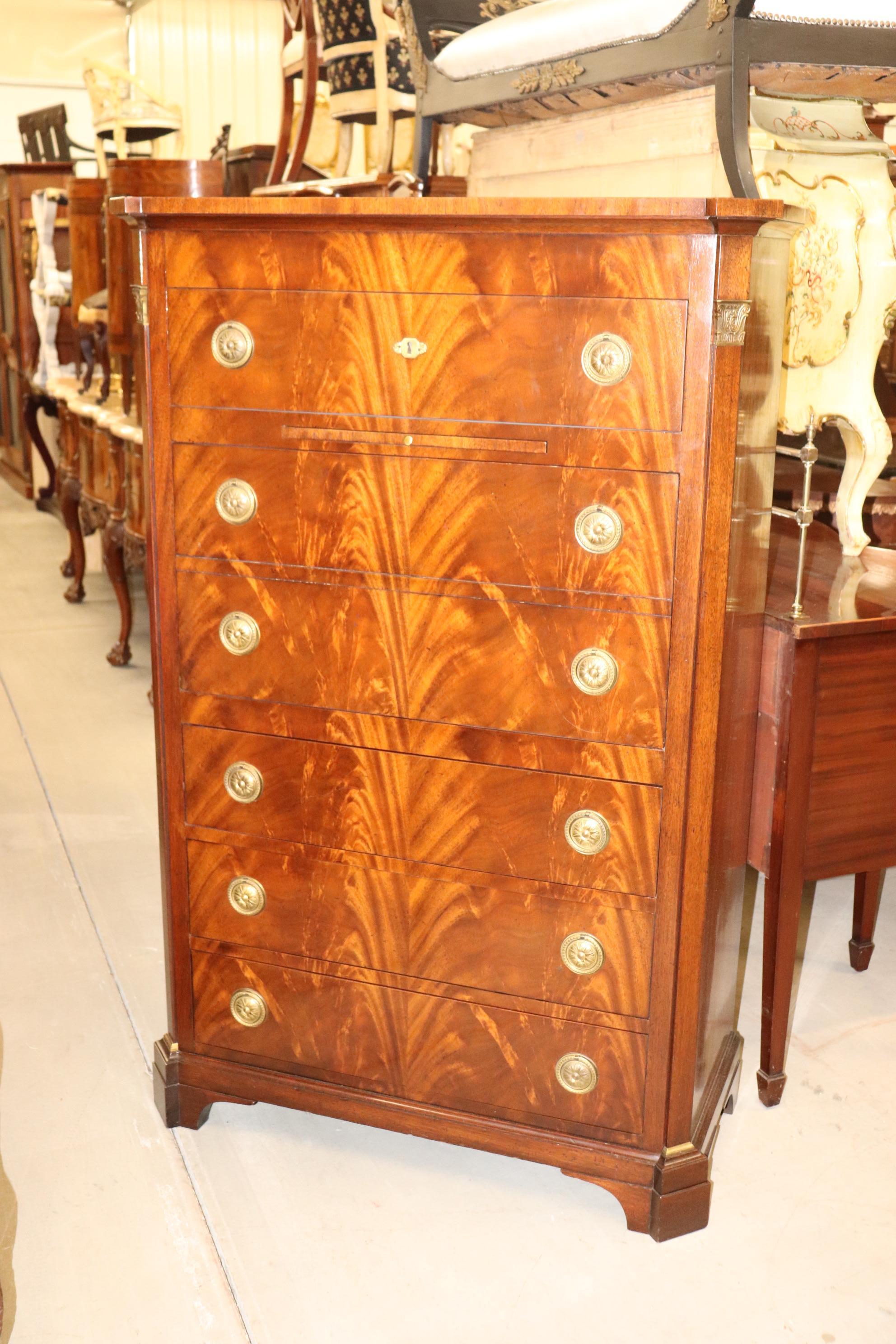 This is a fantastic Baker French Empire style Dresser with solid bronze ormolu and a fantastic flame mahogany case. The drawers are all oak secondary woods and fitted with dovetails. The dresser is in very good condition with minor scuffs and