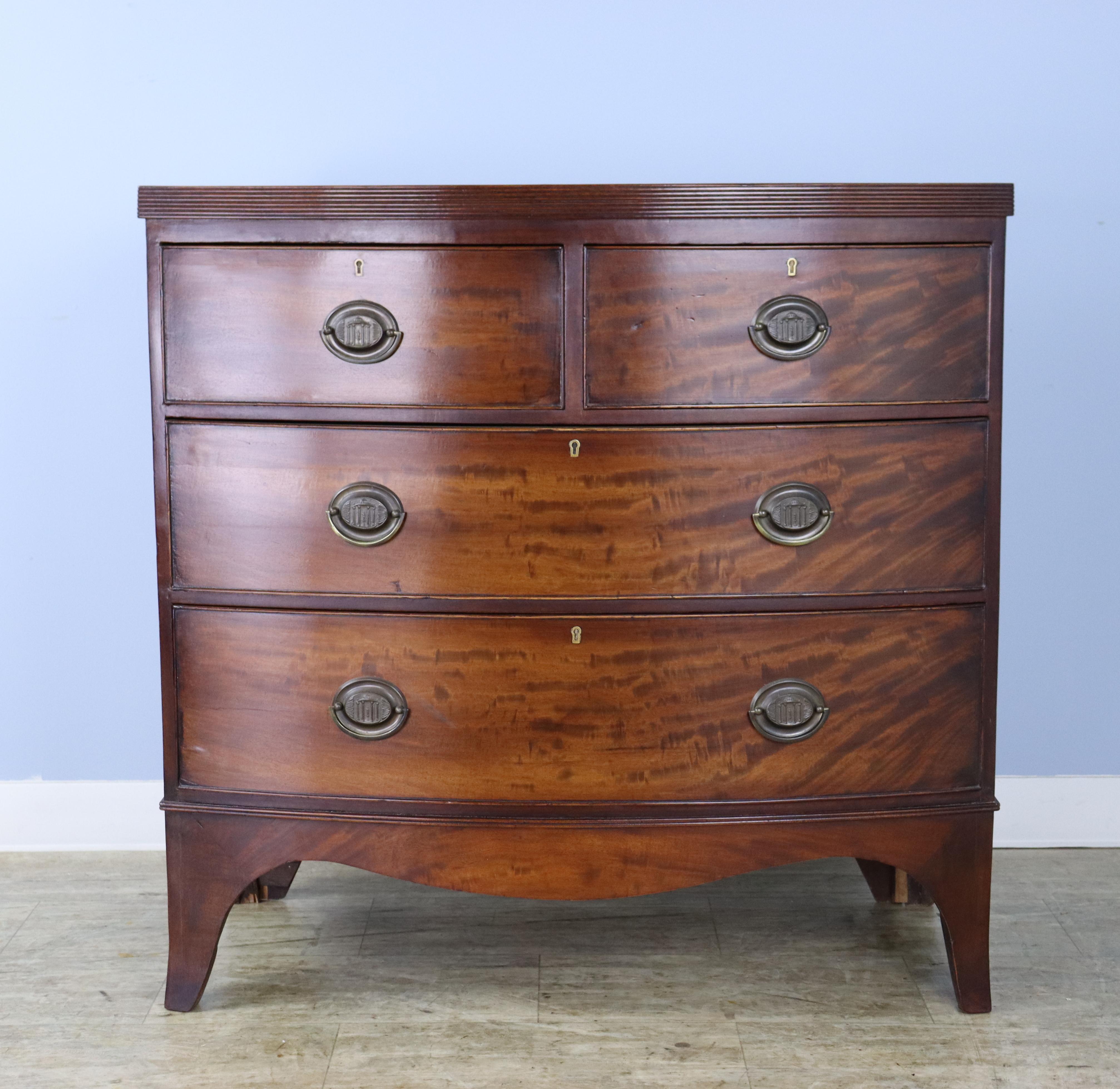 English Flame Mahogany Regency Bowfront Chest of Drawers with Splayed Feet For Sale
