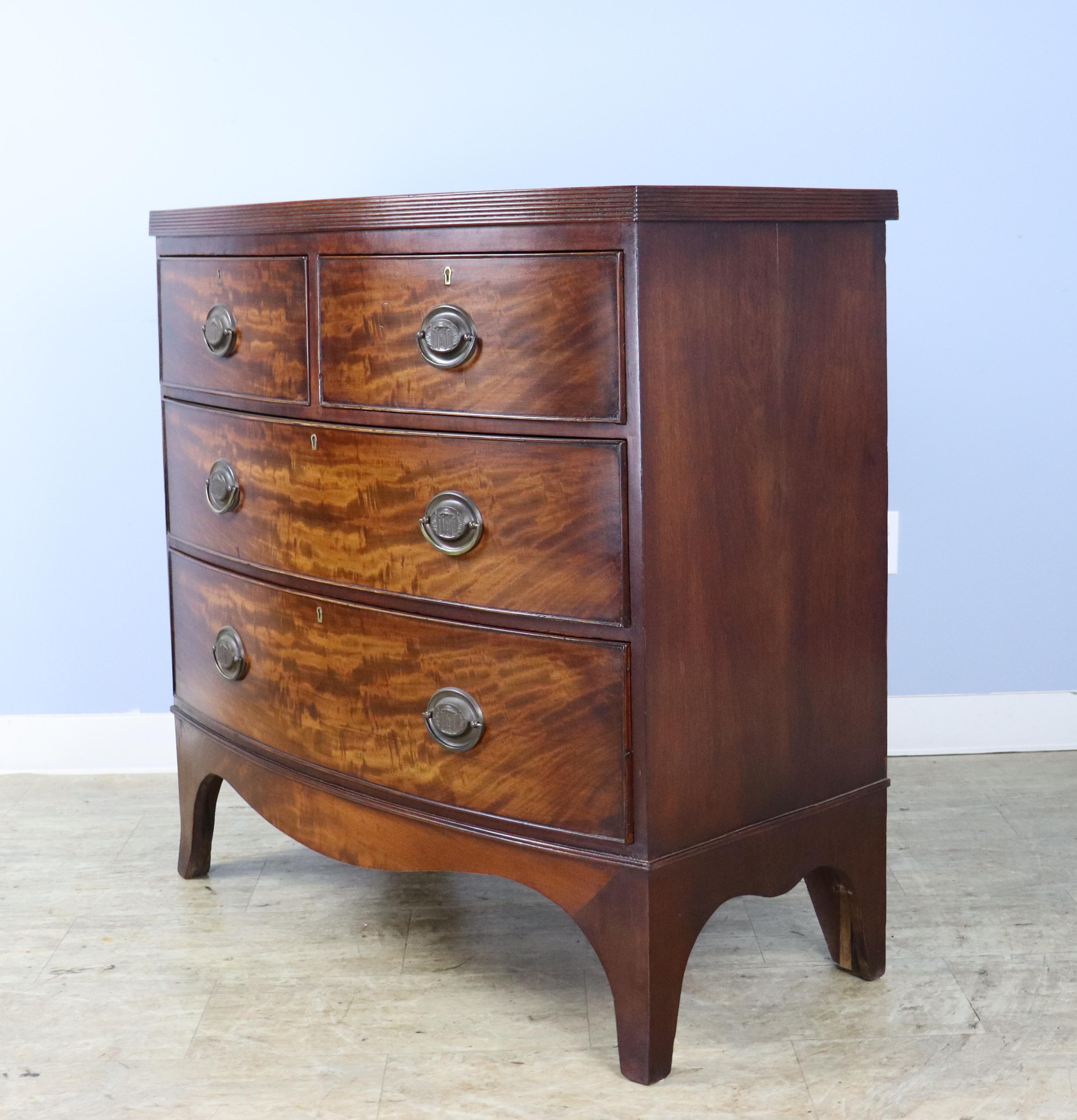Flame Mahogany Regency Bowfront Chest of Drawers with Splayed Feet In Good Condition For Sale In Port Chester, NY