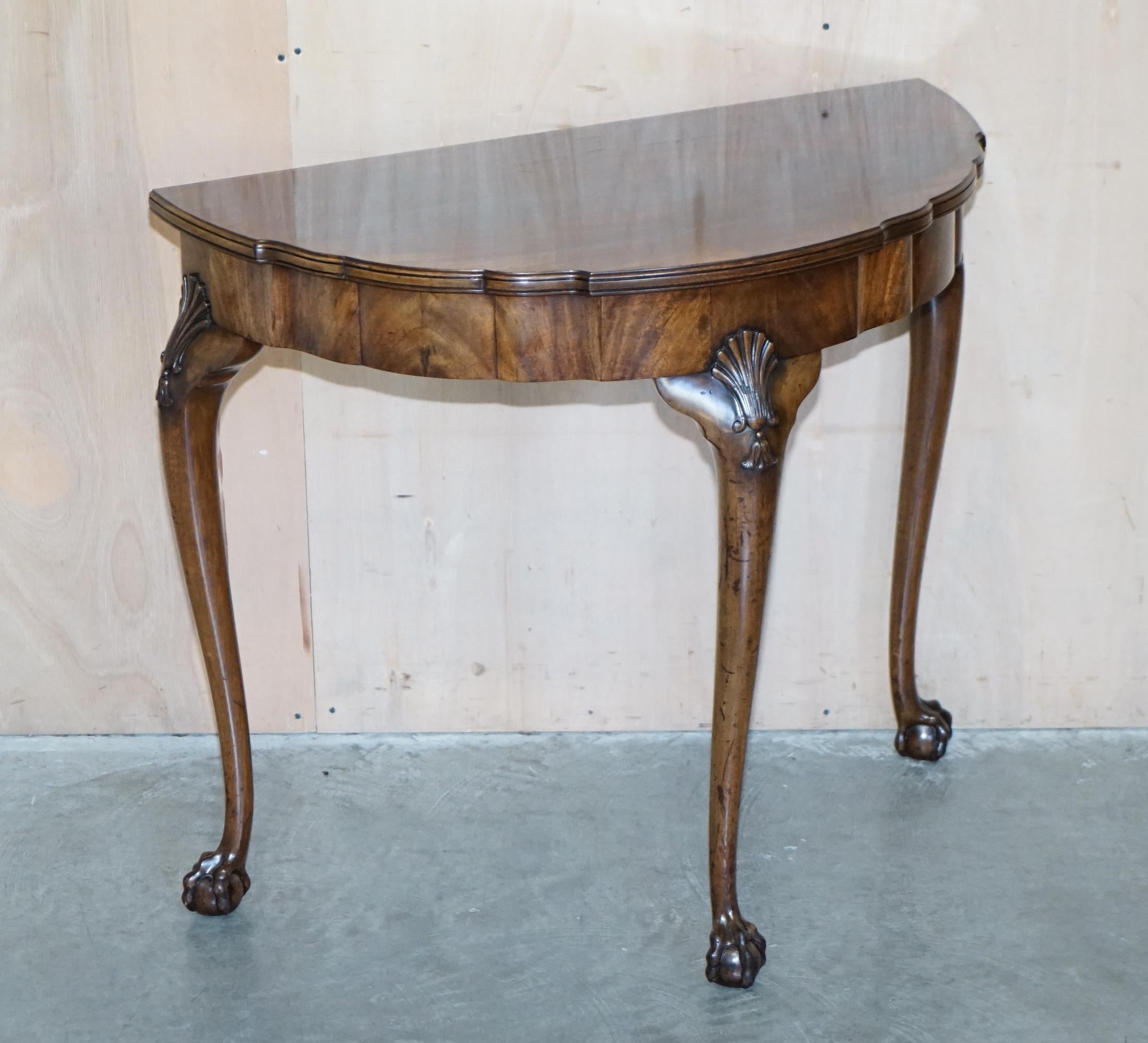 Royal House Antiques

Royal House Antiques is delighted to offer for sale this lovely antique circa 1920 Flamed Mahogany demi lune console table with Claw & Ball legs in the Thomas Chippendale taste 

Please note the delivery fee listed is just a