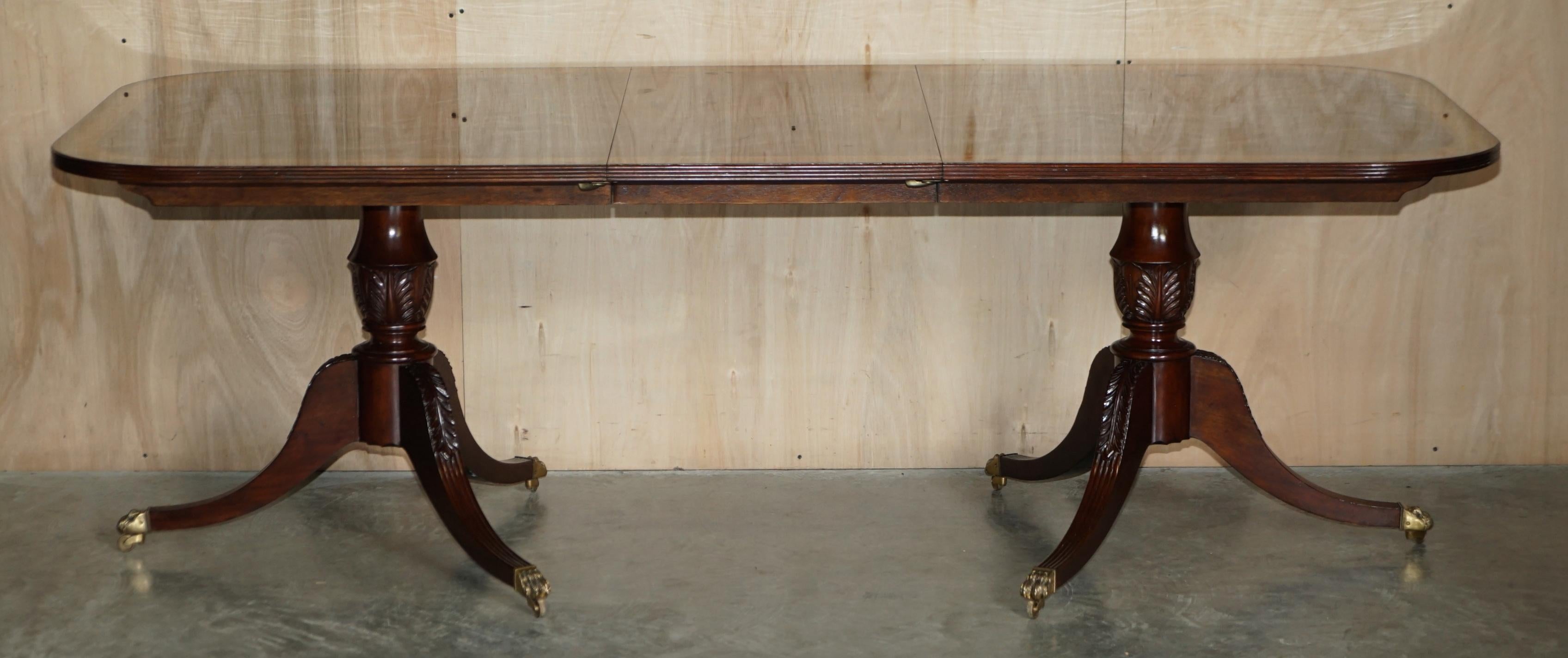 Flamed Hardwood & Walnut Based Tripod Extending Dining Table Brass Castors In Fair Condition For Sale In West Sussex, Pulborough