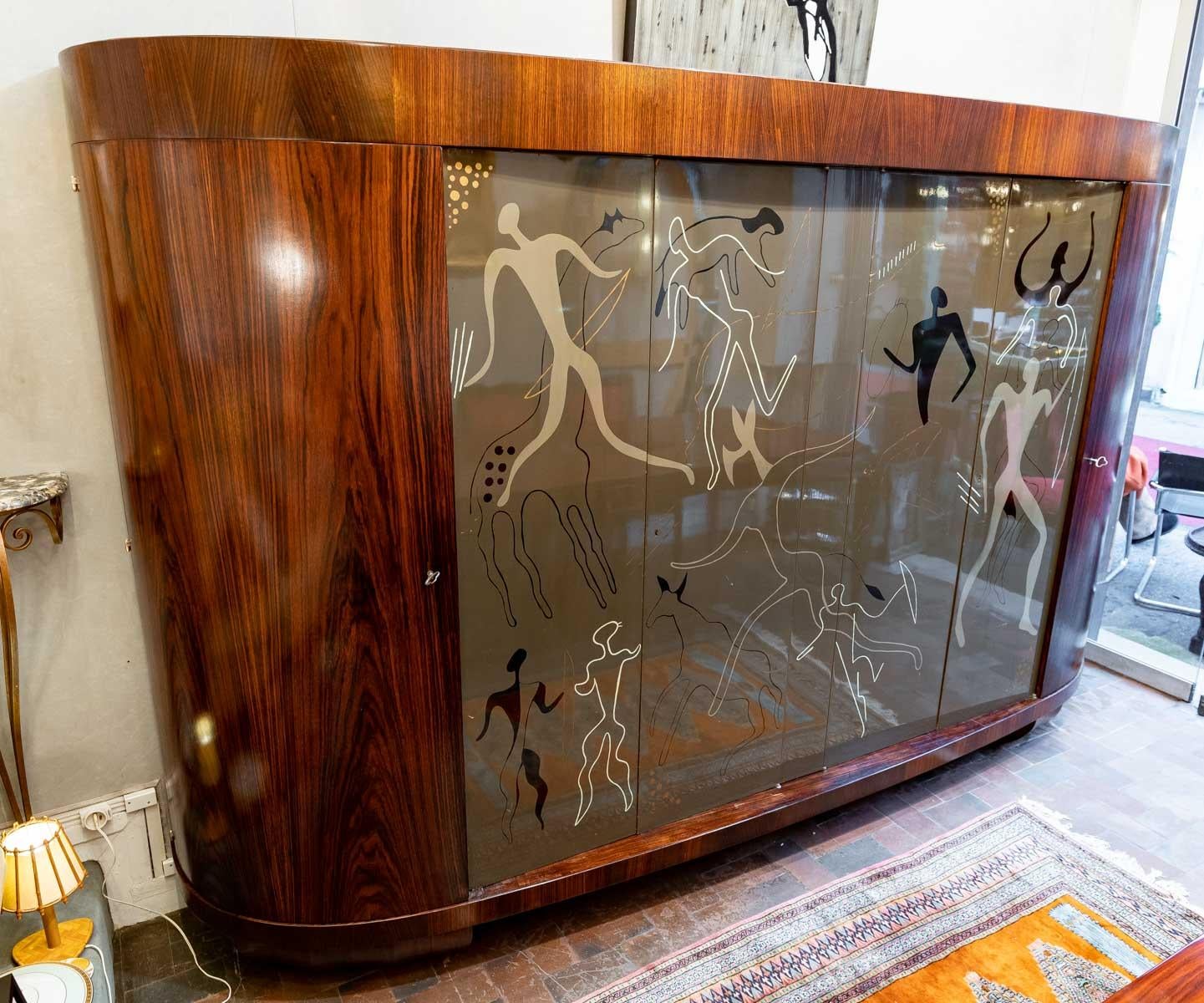 Flamed rosewood wardrobe, unique piece, paintings by Voldemar Boberman

Museum cabinet in varnished flamed rosewood veneer, opening with four doors, two wooden doors with shelves and in the middle, two wooden doors with lacquered metal paintings,