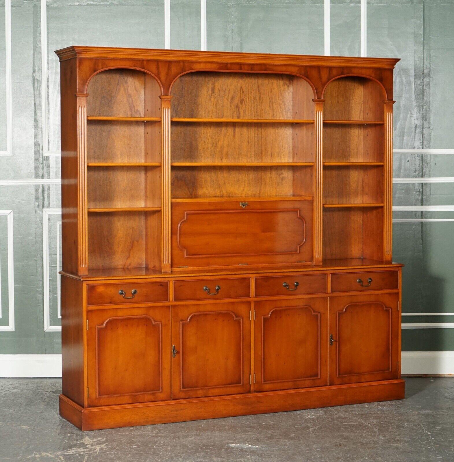 We are excited to present this Stunning Bradley flamed yew wood bookcase with lights and adjustable shelves.

A very lovely well made, and functional piece of furniture, this bookcase splits into two parts for ease of transport and installation.