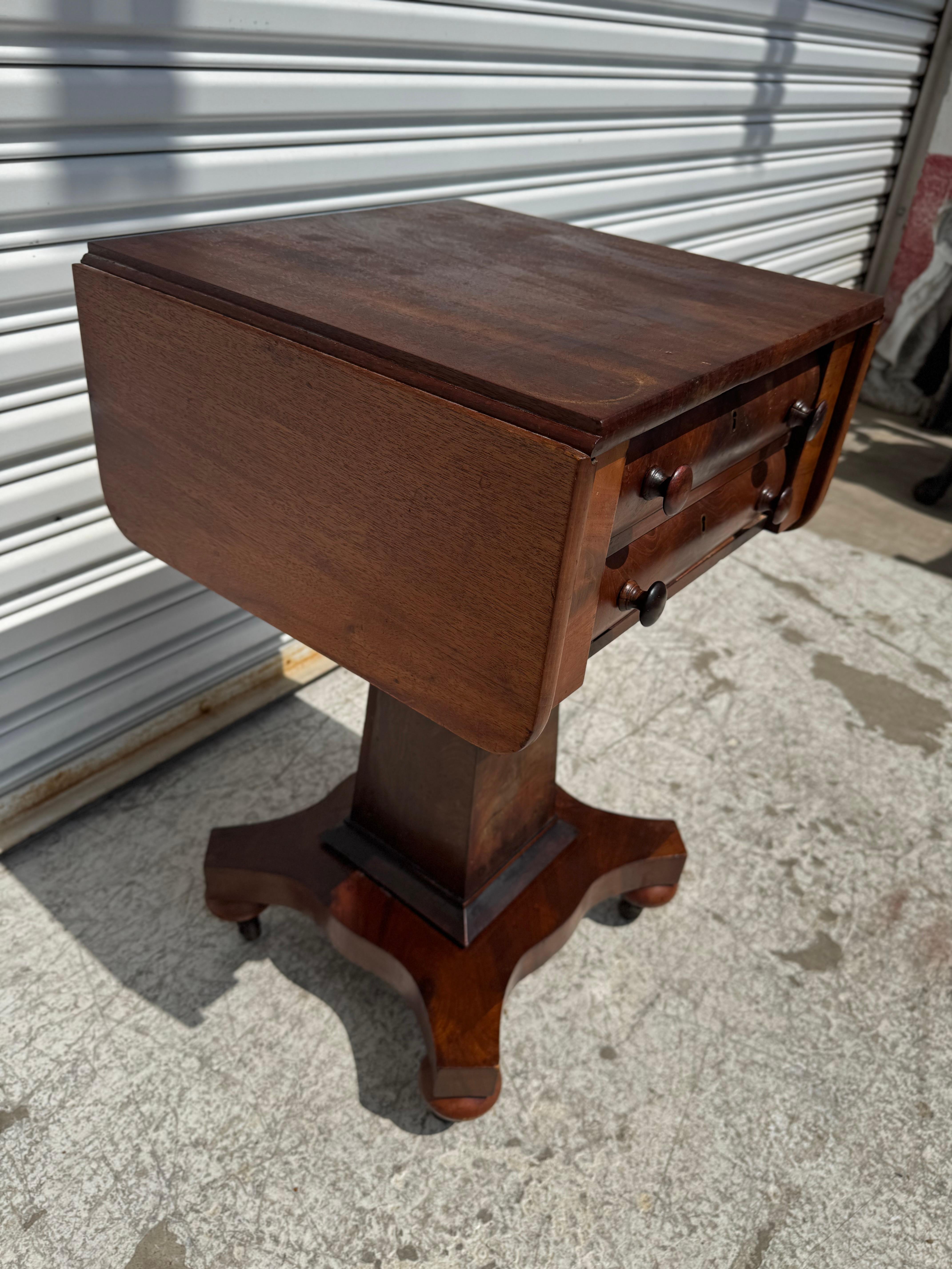 English Flaming Mahogany Empire Revival Drop Leaf Sewing Table by Scheide For Sale
