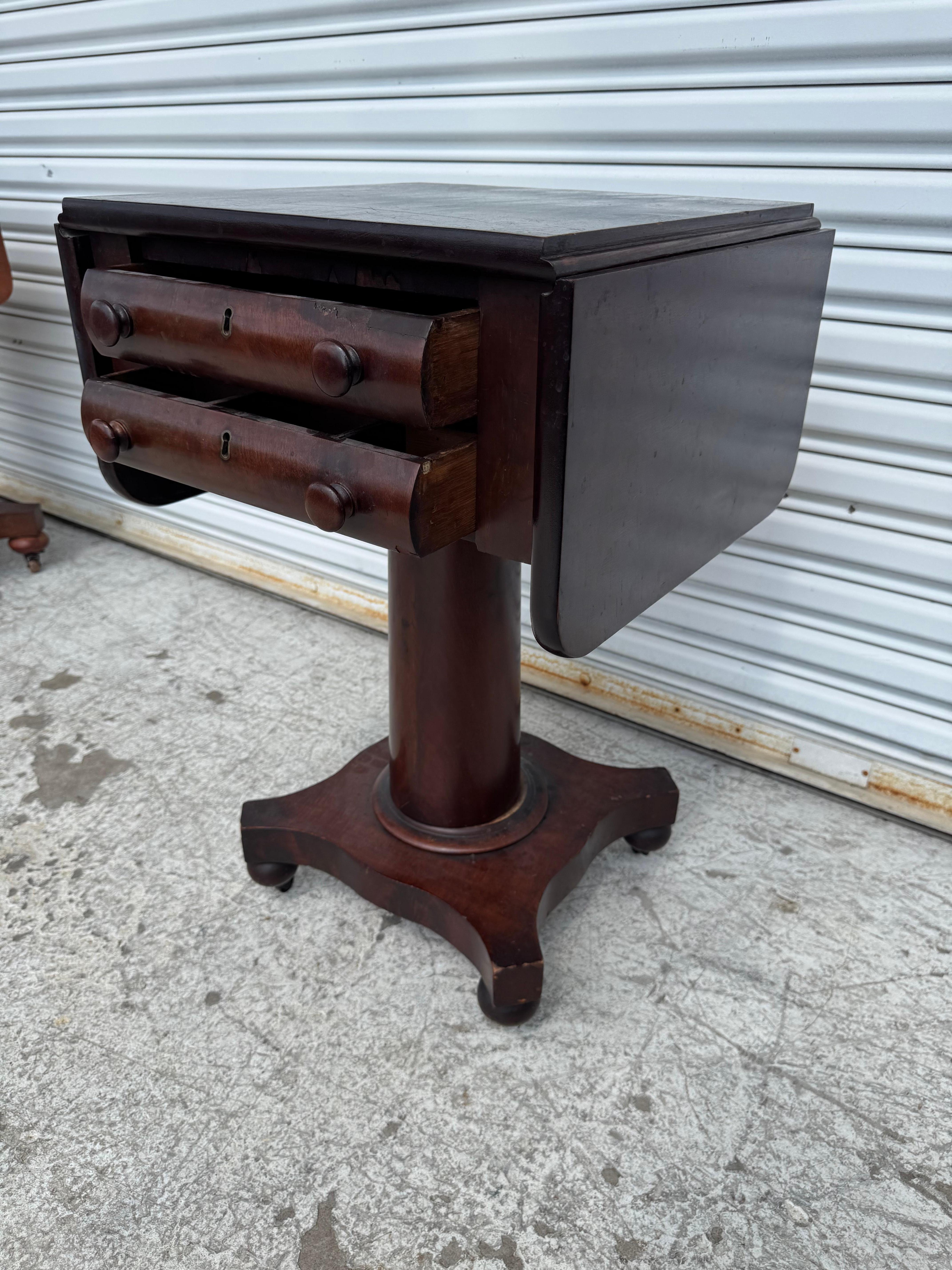 Late 19th Century Flaming Mahogany Empire Revival Drop Leaf Sewing Table For Sale