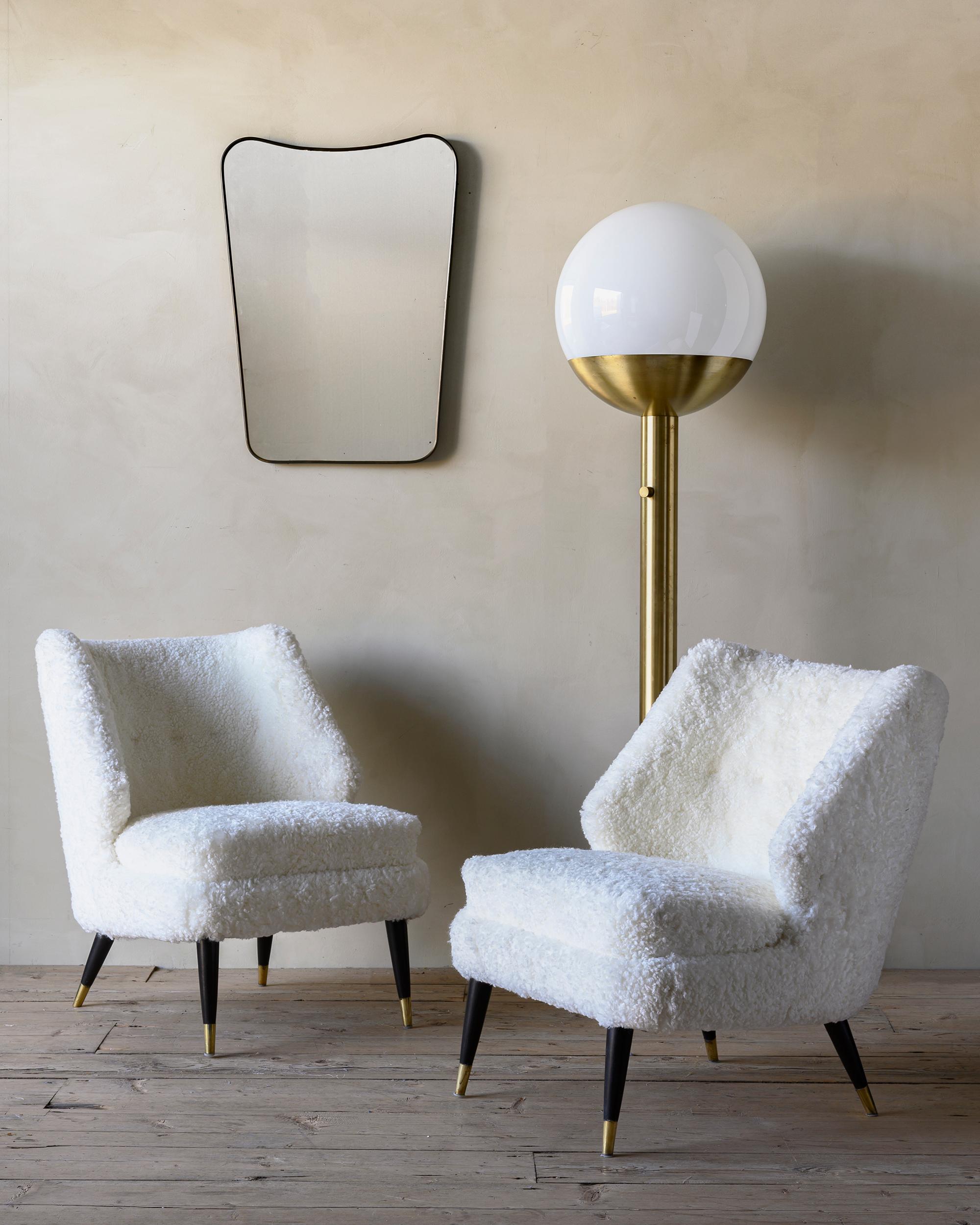 Pair of Danish 1950s armchairs 'Flamingo' designed by Arne Wahl Iversen in 1955. Reupholstered in white Sheepskin Shearling. 

Arne Wahl Iversen was born in 1927 in the small town of Nyborg in Denmark. He grew up in his fathers' furniture store