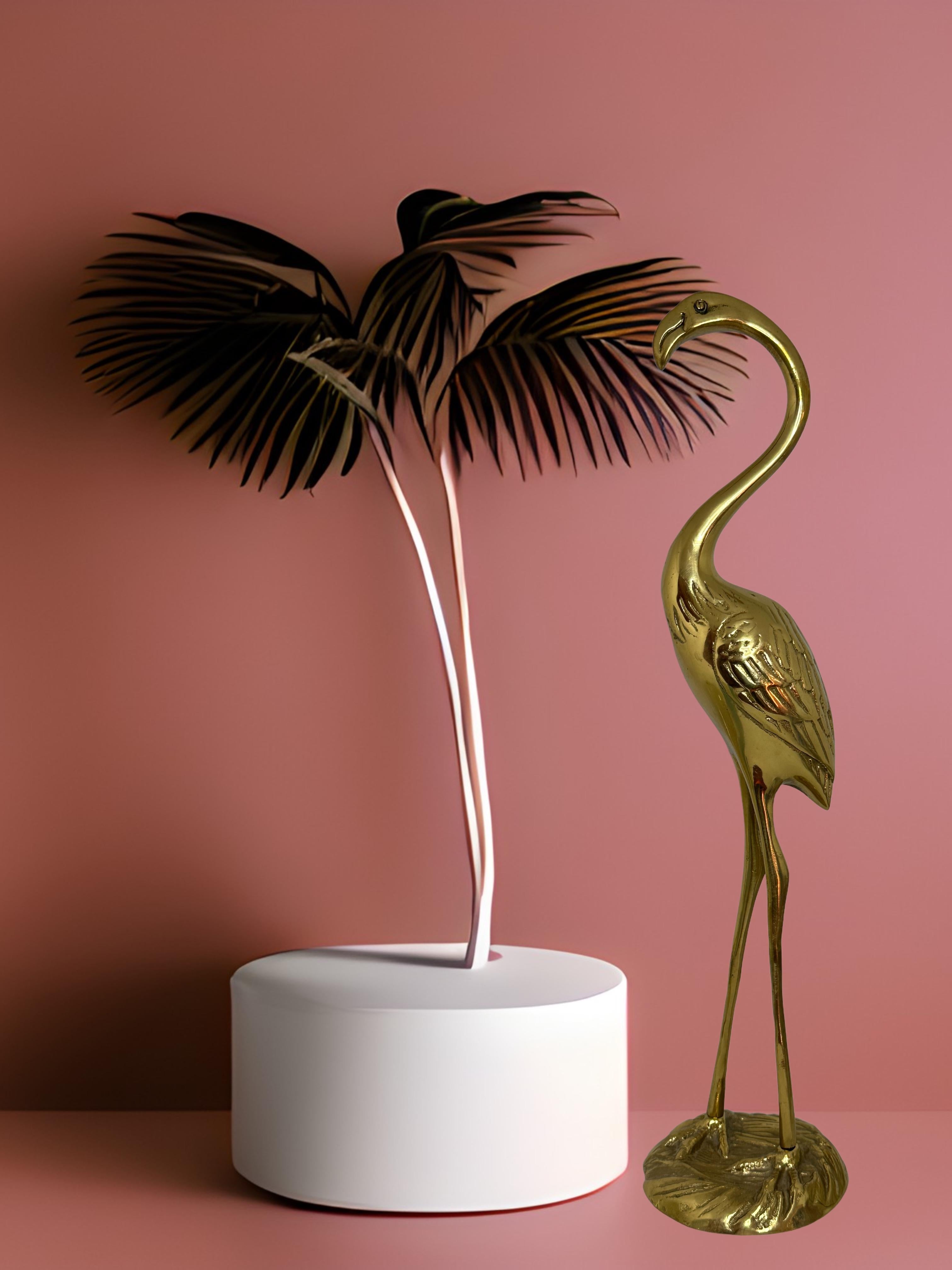 A beautiful vintage brass flamingo statue. This decorative item would make a beautiful addition to any room. Made in the 1960s it displays the joy of that great era with a bold, yet classy statement.