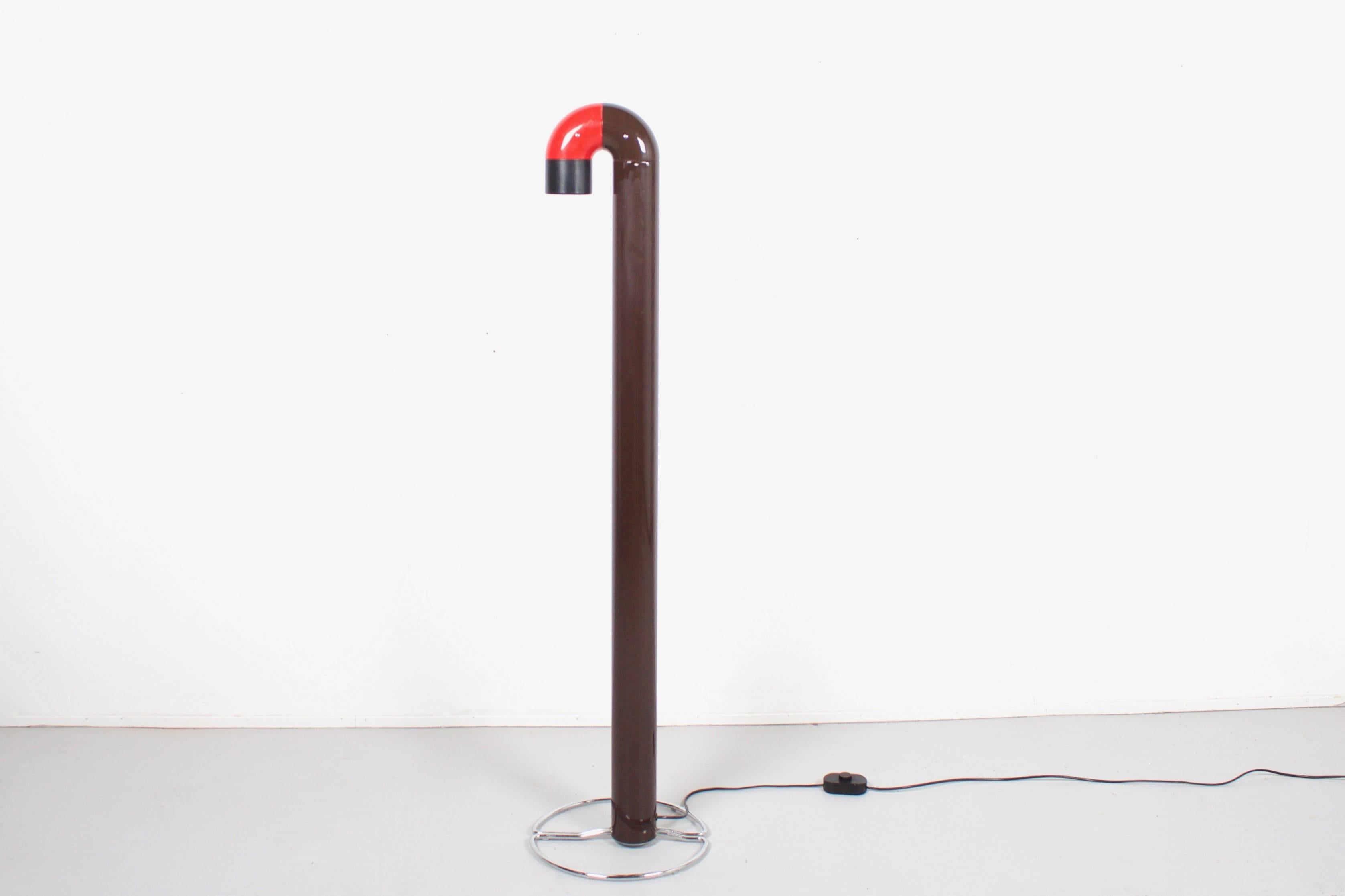 Beautiful Space Age floor lamp by Kwok Hoi Chan in good condition.

Manufactured by the British lighting company Concord in the 1960s. 

The top part of the lamp is adjustable and has a red and brown color scheme. 

It can be used as a reading lamp