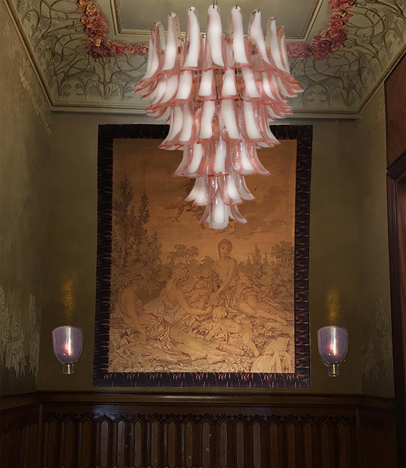 Huge Italian vintage Murano chandelier made by 75 glass petals (pink and white “lattimo”) in a chrome frame.
Period: Late 20th century
Dimensions: 65 inches (165 cm) height with chain, 37.40 inches (95 cm) height without chain, 31.50 inches (80 cm)