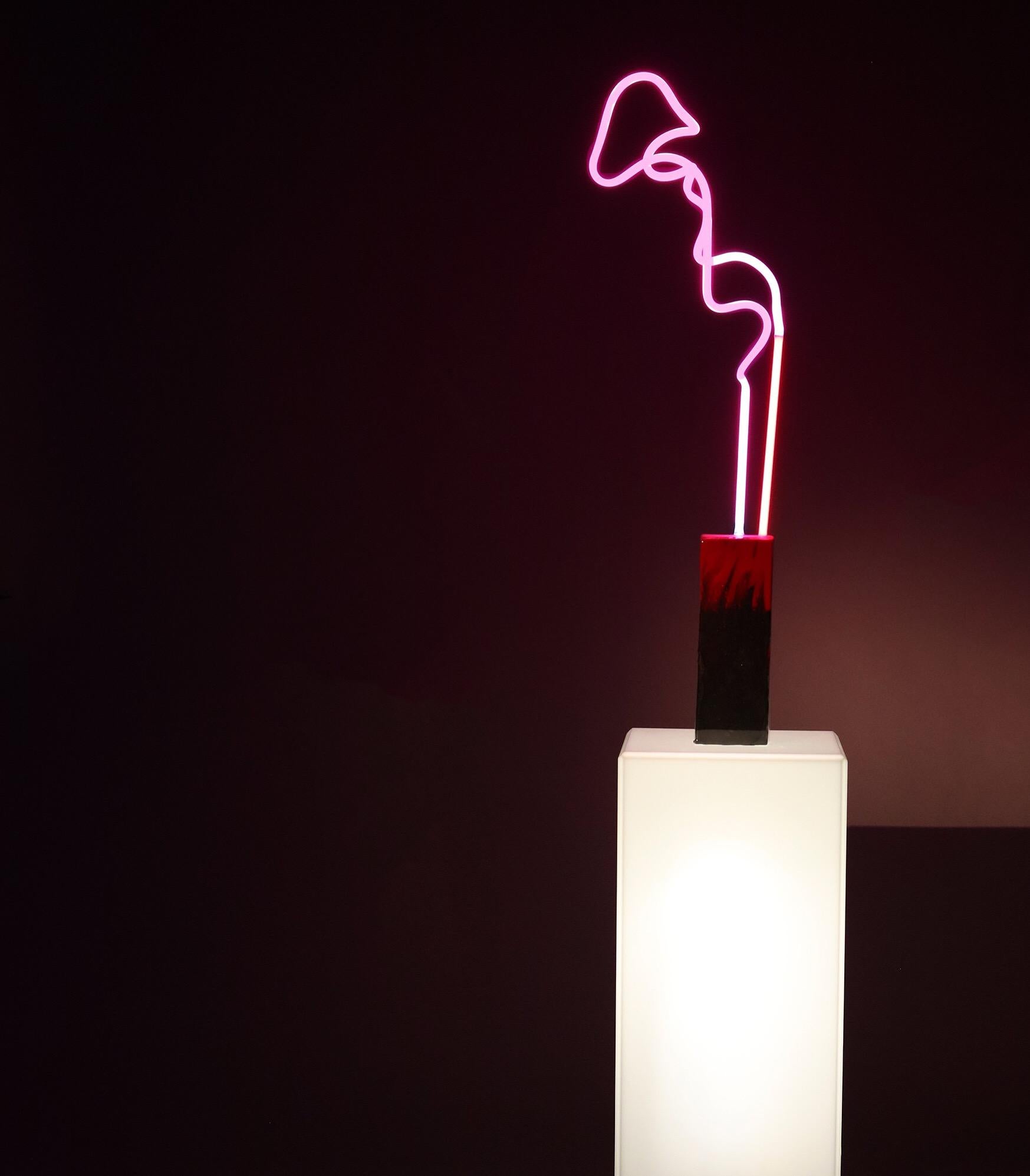 Neon lamps are free standing lights, each base is filled with pigmented resin to create a unique foundation allowing the resin to flow. Every neon lamp is filled with a different gas to achieve different levels of brightness, color and illumination