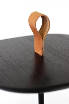 elegant side table  made out of wood , metal and  leather by Gustavo Dias