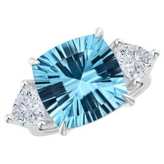 Flanked by Dazzling Trillion Diamonds is a GIA Certified Cushion Sky Blue Topaz