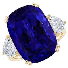 Flanked by Sparkling Trillion Diamonds Is a GIA Certified Cushion Tanzanite Held