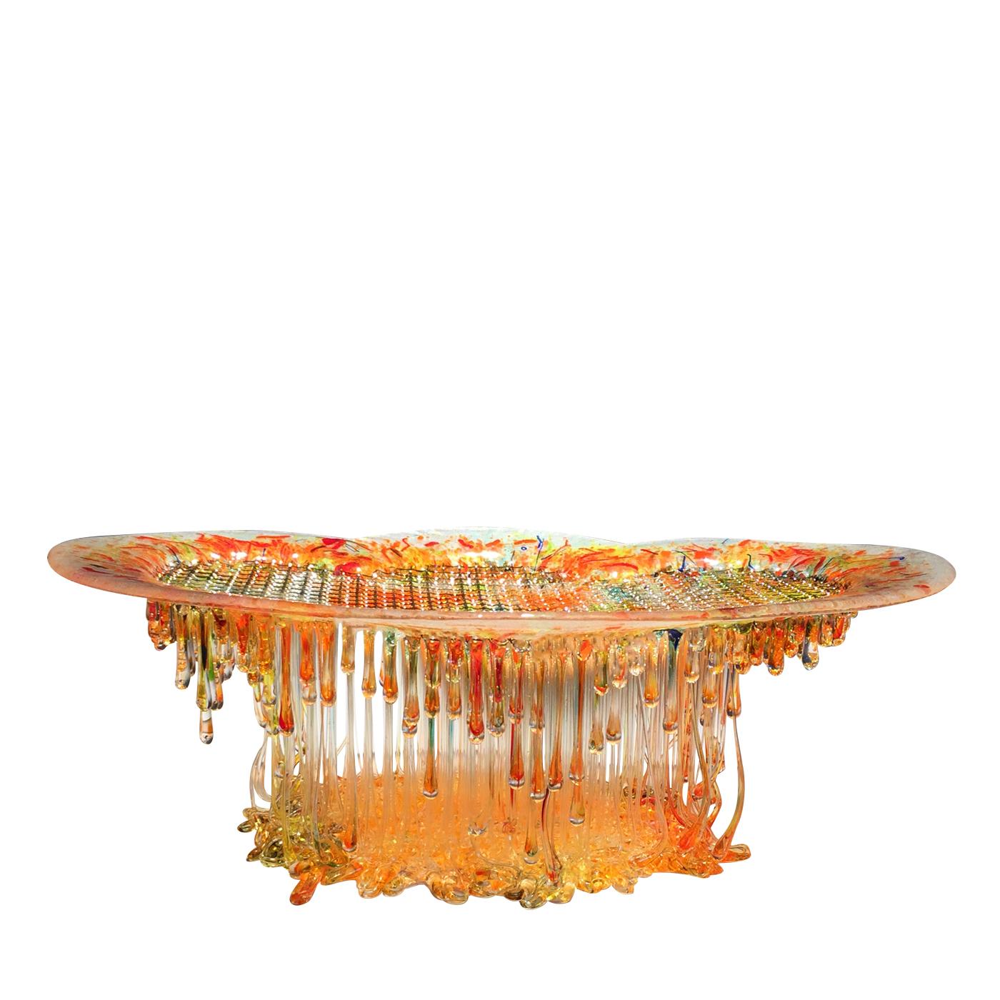 This spectacular and multicolored sculpture is crafted from Murano glass and is a unique piece with its rainbow hues and being reminiscent of a jellyfish its smooth top and multitude of tentacle-shaped forms underneath. Light filters through the top