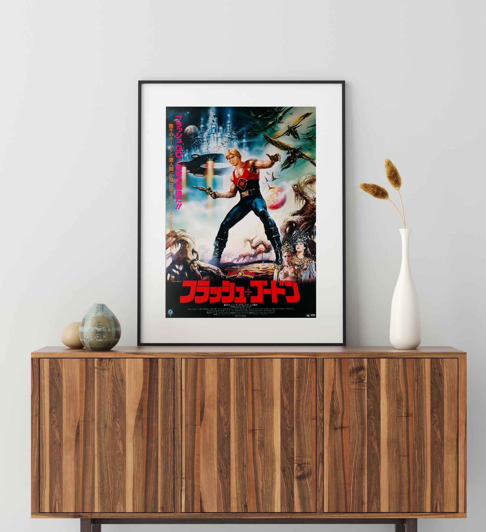 Renato Casaro's artwork looks fantastic on the Japanese original-year-of-release film poster for 80s camp comic classic Flash Gordon, a guilty pleasure for many... ourselves included.

This vintage movie poster is sized 20 1/4 x 28 5/8 inches. It