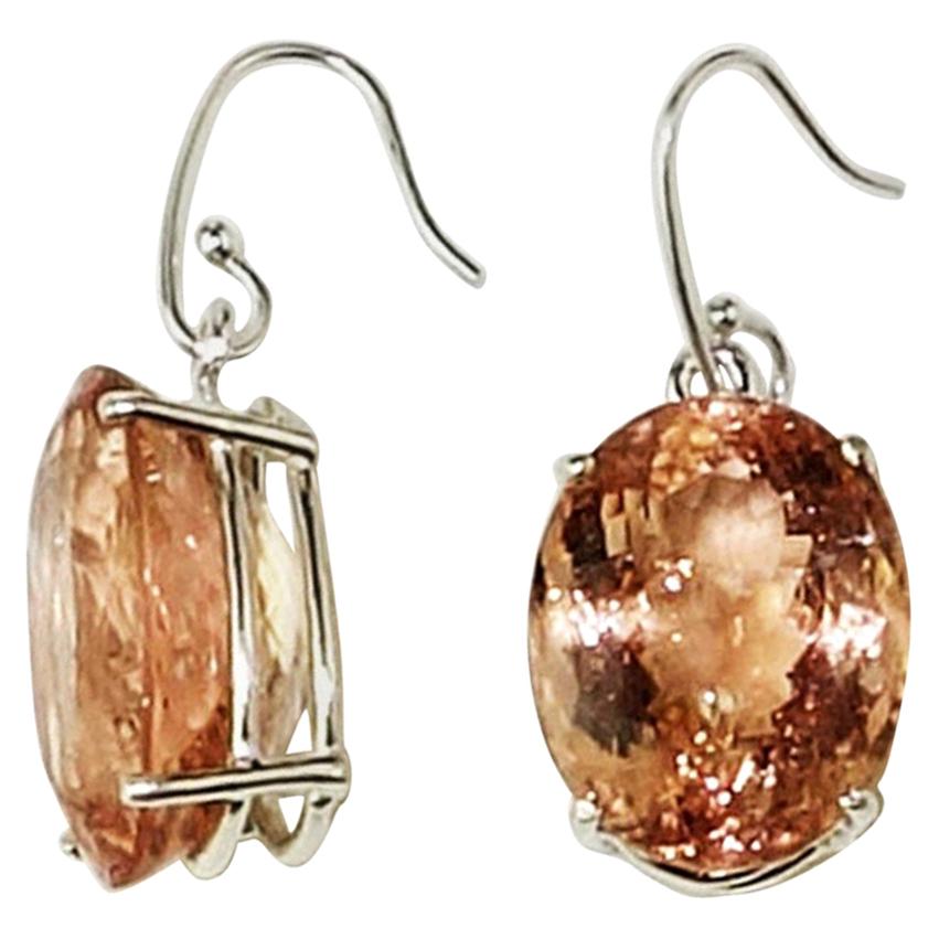These Morganite earrings are perfect when you're teleconferencing!  And, they are available for immediate shipment.
Custom made Morganite oval Earrings set in Sterling Silver with Sterling Silver French hooks. These sparkling Morganites are a treat