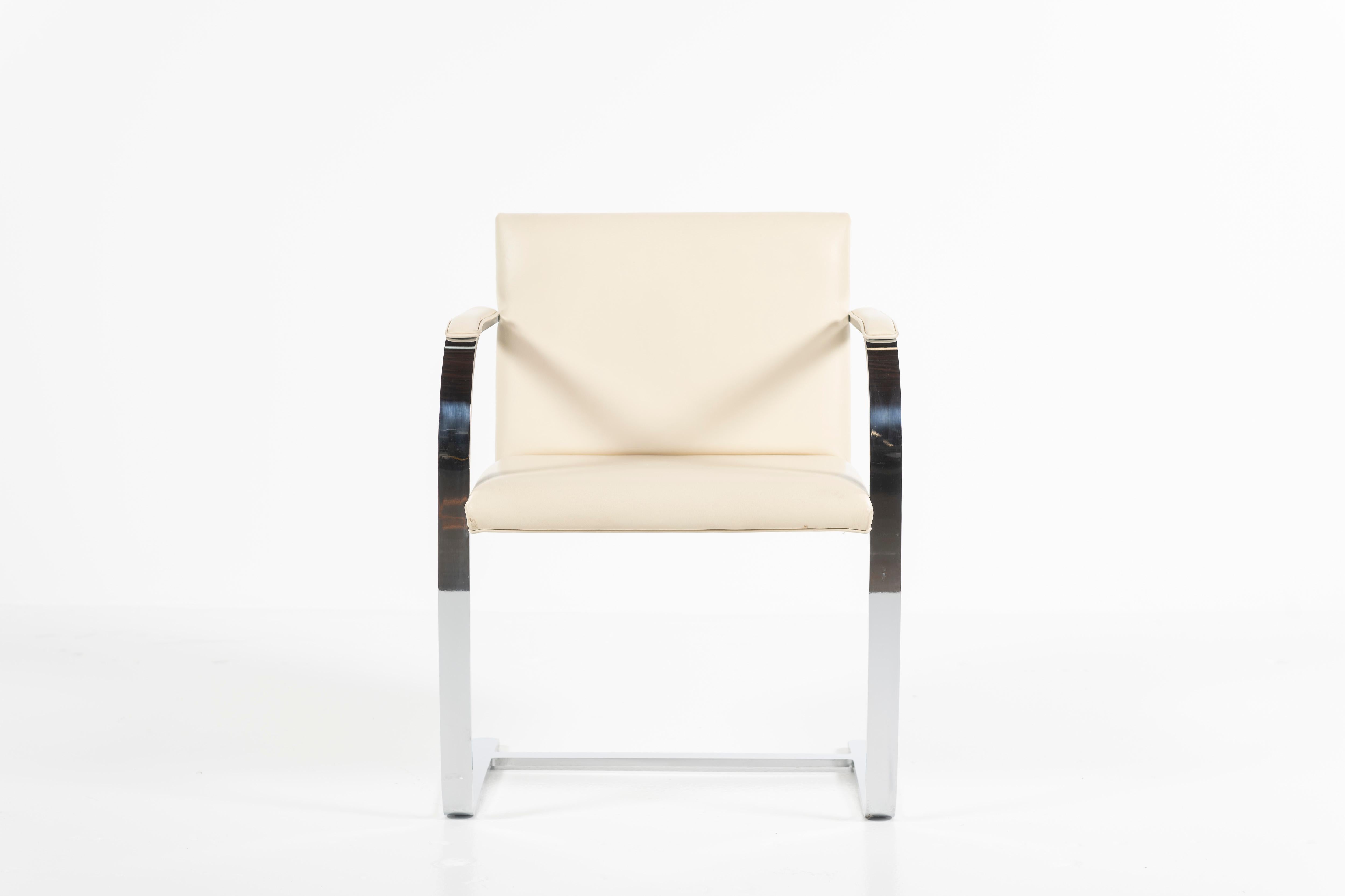 A modern, timeless classic, this chair has a perfect sense of proportion, as well as minimalist form and exquisitely refined details. The cantilevered base and padded arms support the ample seat. Chrome and leather, this piece is ready to place