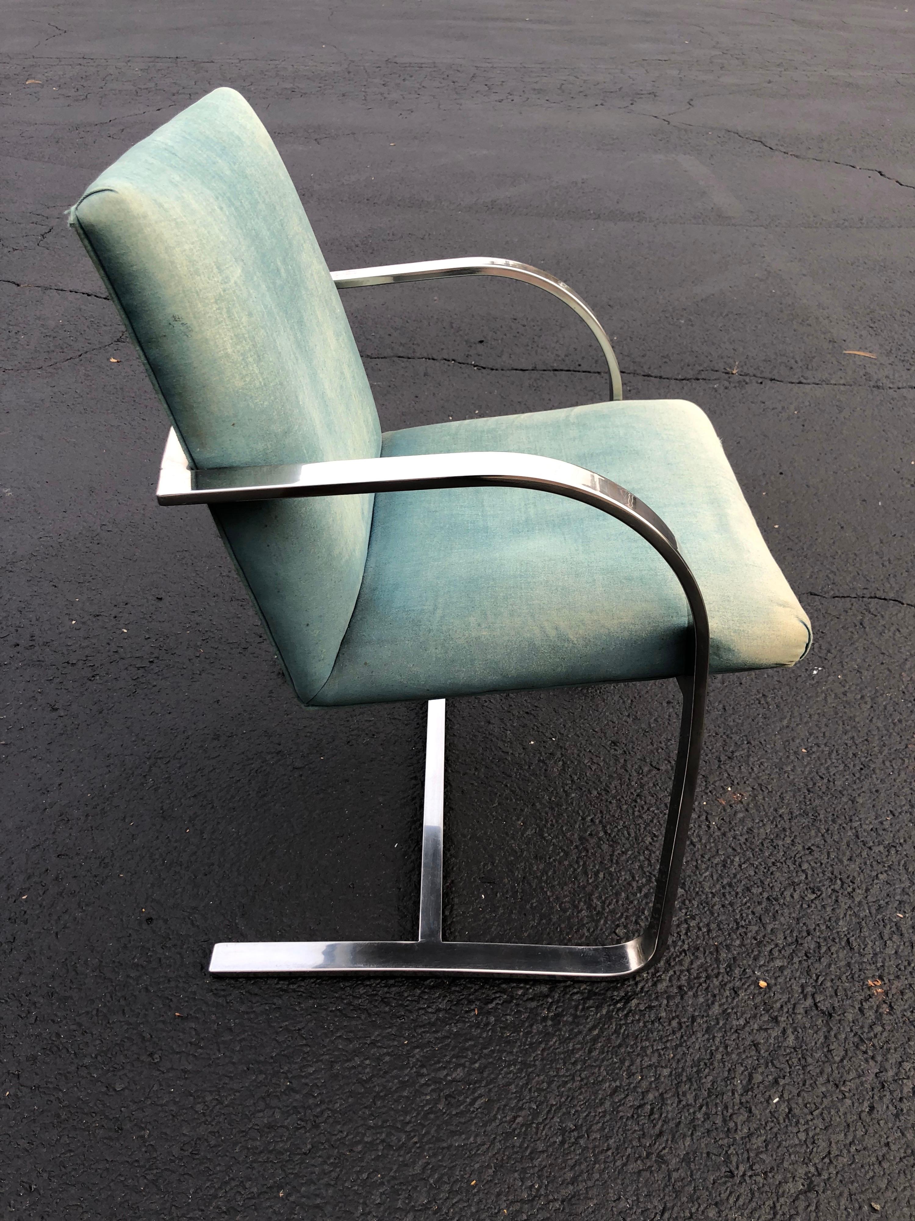 Flat bar Brno style chair .In the style of Ludwig Mies van der Rohe for Knoll. Light eggshell blue upholstery in need of recovering. Classic lines make up this beauty. Use for office or dining.
Arm height is 24.50