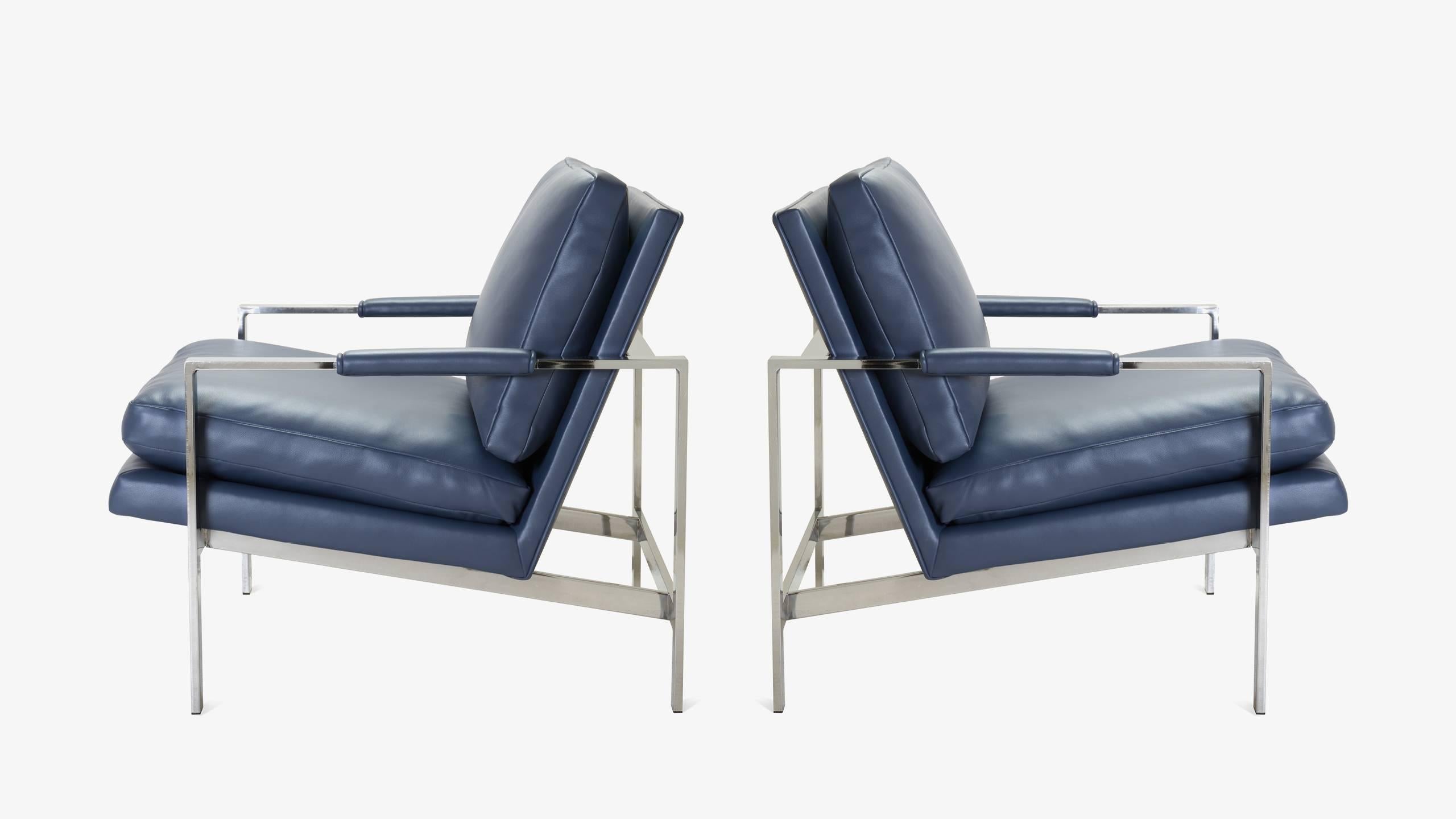 A familiar design from the great designer/manufacturer duo; Milo Baughman for Thayer Coggin. The Montage Workroom completely restored this handsome pair replacing their original vinyl with genuine imported Italian Leather in Navy, an incredibly